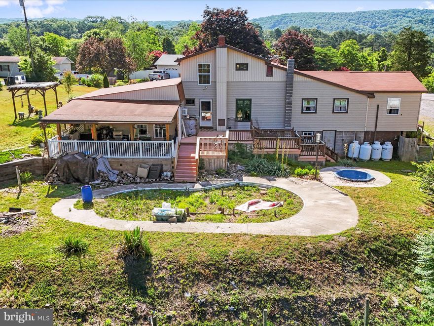 If space is what you desire, your search stops here!  Nestled on just under FIVE ACRES of Wild and Wonderful WV sits this unique multi-level home.  From your back deck you're greeted with majestic mountain views and a serene proximity to Mother Nature.  Aside from the ample living space, this home also boasts a large basement area for storage and a MASSIVE 30x40 detached garage area.  With something to offer everybody, you don't want to miss this one!