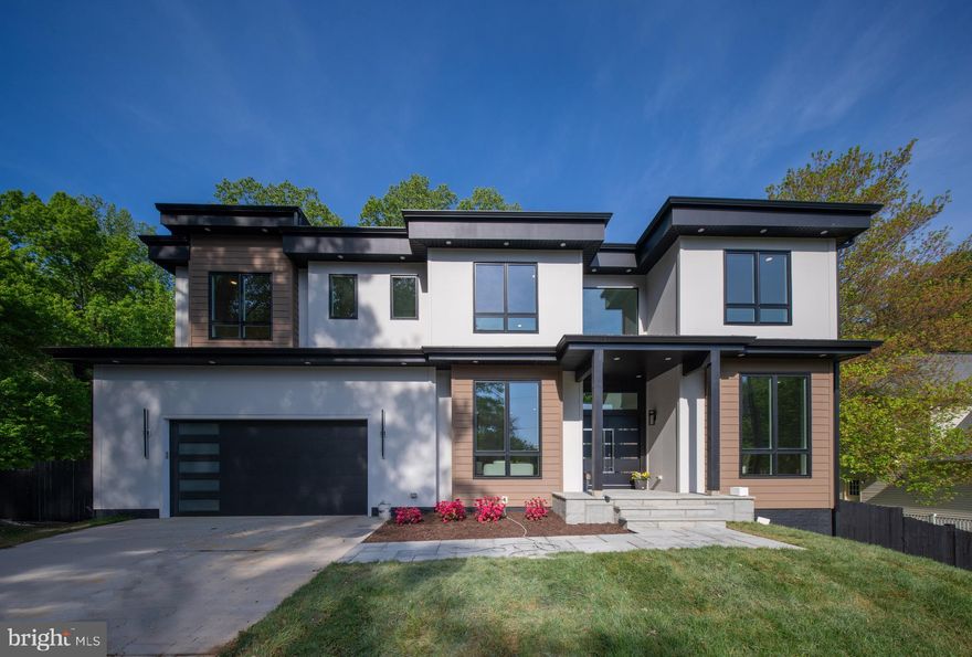 https://view.spiro.media/4134_maple_ave-7852.  This newly built contemporary house is a showstopper! Enjoy peace of mind with a comprehensive 1/2/10 builder warranty *Located in the heart of Fairfax and within the sought-after Woodson High School pyramid, it is an elegant light-filled  three-level  home featuring 6 bedrooms and 6.5 bathrooms. Designed with sophistication and versatility, the home boasts a thoughtfully planned layout highlighted by oversized 8-foot-tall  Lensing windows, soaring ceilings, and 6-inch-wide European oak solid wood floors that enhance its airy, spacious feel. Subtle exterior lighting under the roofline adds a touch of charm and makes this a splendid place to call home. A striking floating glass staircase connects the upper levels, while the open floor plan seamlessly blends formal and informal living areas. The main level showcases a chef’s kitchen with abundant storage, sleek modern finishes, and top-of-the-line appliances—truly equipped with all the bells and whistles. Surround sound system in  both the kitchen and family room is added to effortlessly elevate your sound experience.. A dramatic two-story family room features a linear gas fireplace set against a custom feature wall, creating a warm yet modern ambiance. Additional main-level highlights include a generous dining room, a private office, an en-suite bedroom, a custom-designed mudroom, and a stylish powder room with marble tile and a designer vanity countertop.  Ascending the floating staircase, the upper level reveals a thoughtfully designed private retreat. The luxurious owner’s suite includes two expansive walk-in closets and a spa-like bathroom with a modern free-standing soaking tub, an oversized shower, dual vanities, and heated floors. A spacious second-floor deck  overlooking the backyard provides a serene escape. This level also includes three en-suite bedrooms, each with recessed lighting and ceiling fans, along with a centrally located laundry room for added convenience. The lower level is an entertainer’s dream—featuring a spacious recreation room with a wet bar topped with quartz counters, custom cabinetry, a linear electric fireplace, a wall of wine racks, a wine cooler, and a surround sound system. This level also offers a private guest bedroom with a full bath and a dedicated media room, perfect for movie nights or game days. A bonus is a second laundry room for convenience. The walk-out basement opens to the beautifully designed outdoor living area, which includes a level backyard, a generous patio, and a large deck—ideal for gatherings and enjoying peaceful surroundings.
A two-car garage is pre-wired for electric vehicle charging on both interior walls. Goodman dual zone 17 seer.! 75 gallon water heater. Hardie board siding in front.   Outside, a sleek concrete driveway complements the home's modern aesthetic. This extraordinary residence effortlessly combines elegance, functionality, and contemporary design—truly an exceptional place to call home.  Easy walk to Wonderful community amenity -   Somerset Olde Creek Pool & Rec Club (pool with a slide and diving boards, wading pool,  swim team, swing set, volleyball court, ping pong table, a pavilion with picnic tables) - No Waiting list for membership! Convenient access to  major highways, Vienna metro station.