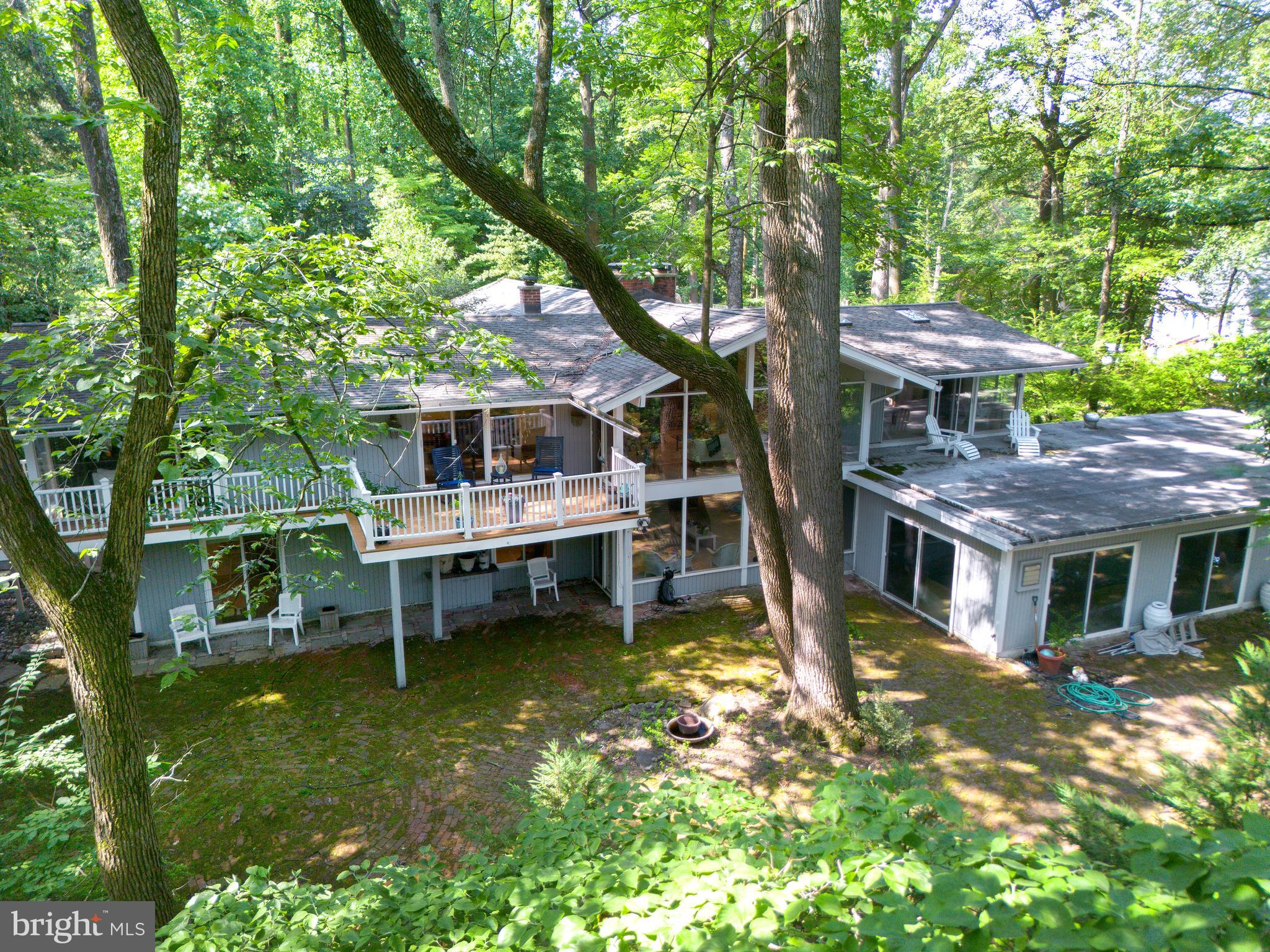 Private, Peaceful, and Perfectly Positioned- Indoor Pool Is Opened
Welcome to 310 Jeffrey Lane—Rumored to be a McElroy House, this beautifully updated ranch-style home is tucked away on a serene cul-de-sac in the coveted Greene Countrie neighborhood of Newtown Square. Set on 1.23 private, wooded acres backing to protected open space, this residence offers the rare blend of modern comfort, natural beauty, and total privacy.
Inside, you're greeted by soaring vaulted ceilings, oversized windows, and hardwood floors that create a warm and airy ambiance. The open-concept living and dining areas are anchored by a striking stone fireplace and flow seamlessly onto a large deck—perfect for entertaining or enjoying your morning coffee surrounded by nature.
The thoughtfully designed layout includes a spacious primary suite tucked privately on one side of the home, complete with a walk-in closet, an updated en-suite bath, and direct deck access. Three additional bedrooms and two full baths are located on the opposite wing, offering flexibility for guests, family, or home office needs.
The walk-out lower level is a standout feature, offering an expansive family room with a second fireplace, a full in-law/guest suite with kitchenette and bath, and sliding doors that open to a peaceful brick patio and a sparkling heated pool with spa. Whether you're hosting friends or seeking quiet relaxation, this outdoor space is a true retreat.
Additional highlights include an attached two-car garage, mature landscaping, and the unbeatable benefit of backing to woods that can never be developed—ensuring privacy and tranquility for years to come.
With easy access to downtown Wayne, Newtown Square, and top-rated schools, 310 Jeffrey Lane is a rare opportunity to enjoy the best of Main Line living in a secluded and stylish setting.