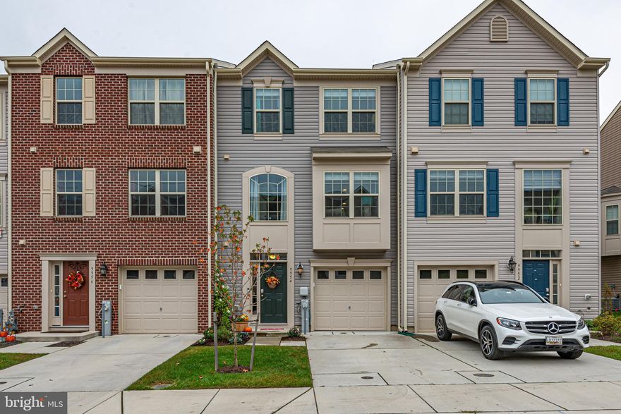 Pristine, nearly new garage townhouse is in a super convenient location, yet feels private and tucked away. You will love the functional layout, beautiful kitchen and bathrooms, and on trend finishes. The main level features an open plan, perfect for entertaining. There is an exterior door from the kitchen to the deck, which backs to trees and feels very private. Just imagine relaxing here after a long day with a glass of wine, or firing up the grill on the weekends for a barbecue with friends. Upstairs, the owner's bedroom is at the back of the house with that beautiful view of the trees, and features a walk in closet and en suite bathroom with oversized tile shower and double sinks. There is a super convenient laundry closet right outside the owner's bedroom door. There are two more bedrooms on this level along with another full bathroom. On the ground level, behind the garage and entry hall, there is a fourth bedroom that could alternatively be used as a spacious home office, home school space, playroom, or fitness/family/media room. There is also a half bathroom on the ground floor, and a door to the rear yard, which you can enjoy without lifting a finger because the homeowner's association takes care of mowing the grass. Come check out this great neighborhood, close to everything, yet tucked away. ***View the linked Matterport 3D tour.***