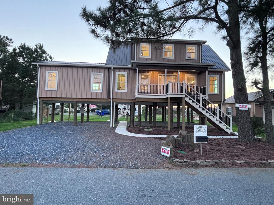 Located at the Delaware Bay behind Dover Air Force Base.  Peaceful, quiet, and scenic community away from the hustle and bustle but only fifteen minutes to stores, health care, and employment.    Live here year round or as a vacation home on the water.    Walk the beach daily.   Wetlands, Conservation Areas, trails, and cornfields.   Amish built and ready to move in.   Very nice custom home with quality hardwood floors throughout and a fantastic kitchen.   Prewired for a cargo lift / elevator. Option to purchase the detached garage which sits on the next door separate parcel.