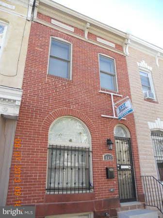 This move in ready Brick Town House has all the Bells, Stainless Steel Appliances, Fenced Back Yard, Wood Floors, Full Bath on Main, Bright Open Kitchen, Strom Doors and Windows, Water Proofing in Basement, 2 Nice Size Bedrooms, Like New Washer and Dryer, Central Air, On an Established Block, Directly across from Johns Hopkins New School. Best House in the area. Come take a look.