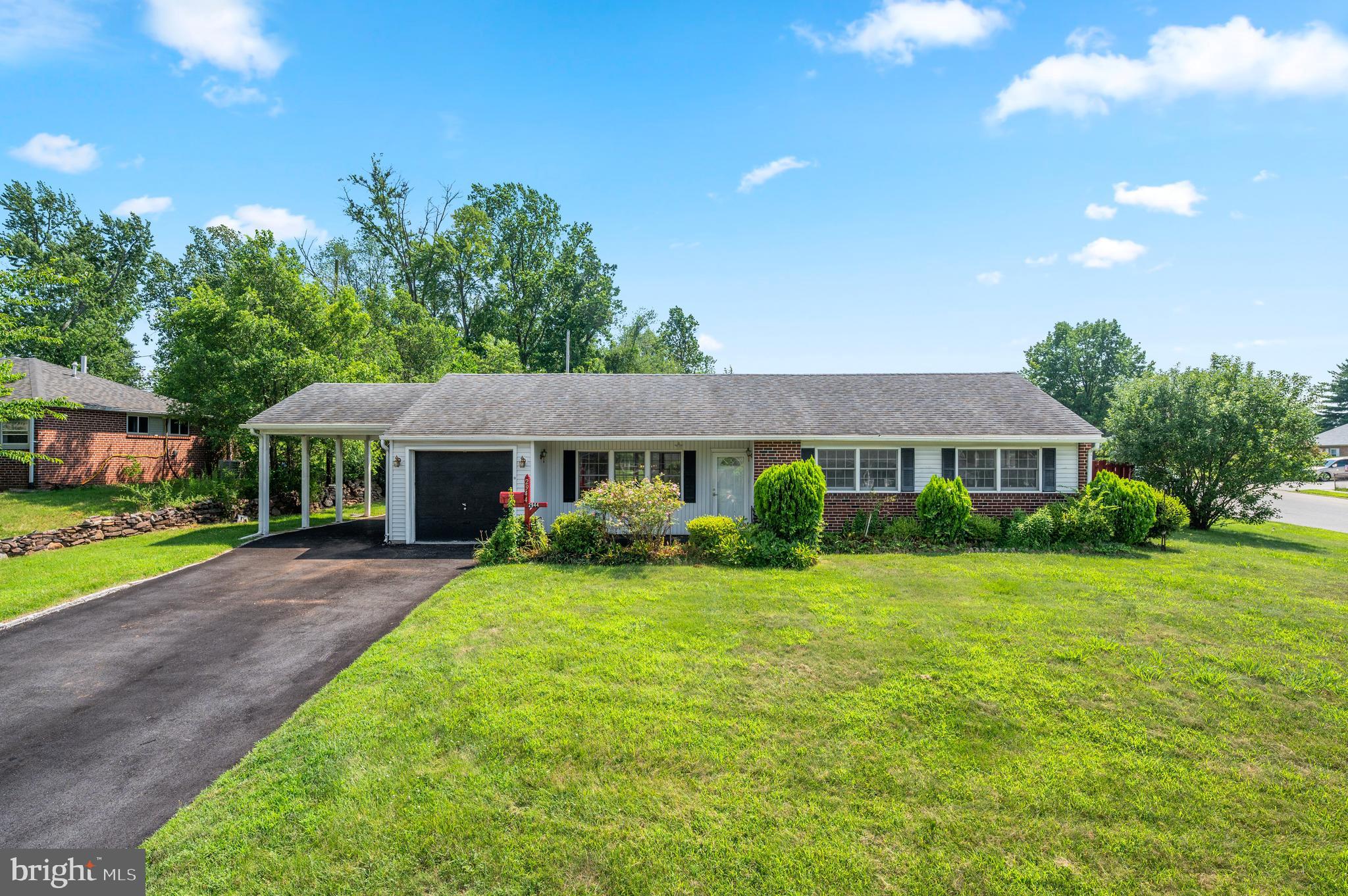 Welcome to Penn Square, a fantastic neighborhood convenient to shopping, transportation and major commuting routes. This ranch home is the perfect setting for easy one-level living on a desirable corner lot. You'll appreciate the open living and dining rooms, adjacent to the nicely-sized kitchen with large breakfast bar. There's extensive counter space and plenty of cabinetry, plus access to the rear covered patio. The back yard and patio are ideal for entertaining, relaxing and gardening. Three bedrooms, a full bath and several closets provide everything you need. You'll also love the extra storage opportunities in the laundry/mudroom, attached garage and rear shed. Want more? How about central air, additional covered parking under the carport, and a 1-year home warranty for peace of mind. With a fresh coat of paint and your vision, this home is ready for you to make your own, to create the life you're dreaming of!