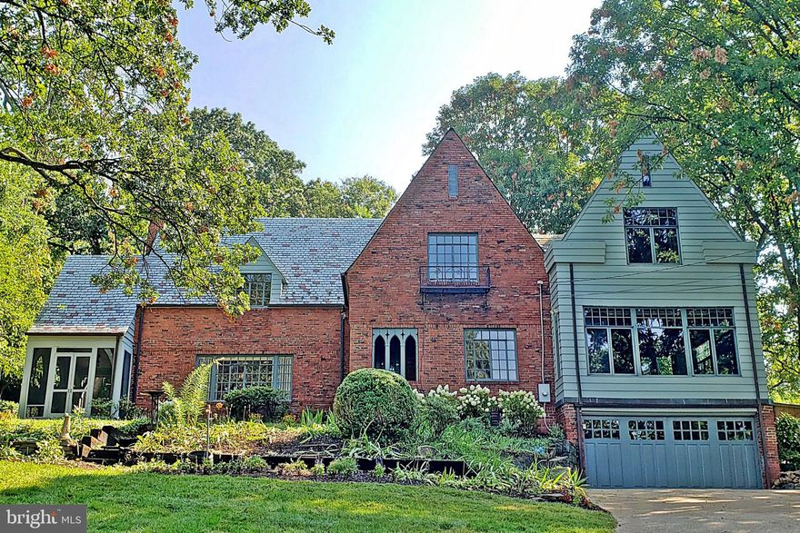 OPEN HOUSE Sunday 9/19, 1-3pm.  Hard to find expanded Tudor located in the prestigious Arlington Ridge neighborhood. Large addition offers open kitchen with walls of windows offering abundant natural light and sweeping views.  Primary bedroom suite includes adjoining nursery/office. Gorgeous setting on 17,000 sq. ft. lot with mature trees, shrubs, flower beds blooming from spring to fall, koi pond, flagstone walkways and front & rear patios. Panoramic views overlooking the valley below.  Fenced, private, wooded back yard.  3 spacious bedrooms, 4 baths.  Extra service kitchen for entertaining.  Lower level offers recreation room and study. 2 car attached garage. Screened-in porch off the living room. 2 woodburning fireplaces. Newly refinished hardwood floors.  New air conditioner.  Rare to find with this setting in such a close-in location. Just minutes to Crystal City, 2 Metro’s, Amazon HQ2, Reagan National. Airport, the Pentagon, Washington DC.