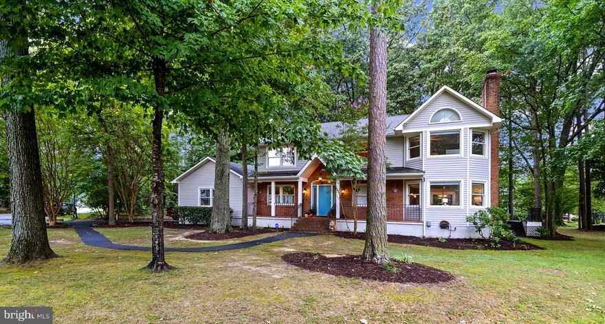 Beautiful 5 bedroom, 3 bath home in sought after Swan Point neighborhood, sitting on a corner lot with seasonal water views of the Potomac River! Walk into the main level you will find a study on your left which can also serve as a main level bedroom with french doors for privacy. The other side features a cozy family room, gas fireplace with stone surround and hand crafted walnut mantle. From the family room you will find a separate dining room with two sets of french doors leading out to the deck. In the center of the house is the bright, open, eat-in kitchen which has an ample amount of cabinets and counterspace, stainless steel appliances and walk-in pantry with another door leading to the deck. Down the hall is a full bath, laundry area and access to the 2 car garage. Upstairs you will find a loft area providing a perfect reading nook or kids space. Large primary bedroom has a fireplace with brick surround and sitting area. Primary bath was just recently remodeled and has a large dual sink vanity, a beautiful tiled shower, tile flooring and free standing tub. Walk-in closet with custom organization system. There are three additional bedrooms, one of which has a balcony and a third full bathroom with dual sink vanity. There is plenty of space for entertaining on the large wrap around deck. Flat back yard is a great area for kids with a play set. If you have pets, there is already an invisible fence installed and two doggy doors in the house. Enjoy your morning coffee on the covered front porch. Swan Point is a golf course community featuring an 18 hole championship golf course, club house with bar and restaurant, outdoor swimming pool, walking trails, bike trails, tennis courts, basketball courts, private beach area, boat storage and boat ramp access to the river. This neighborhood has it all! Schedule your showing today!