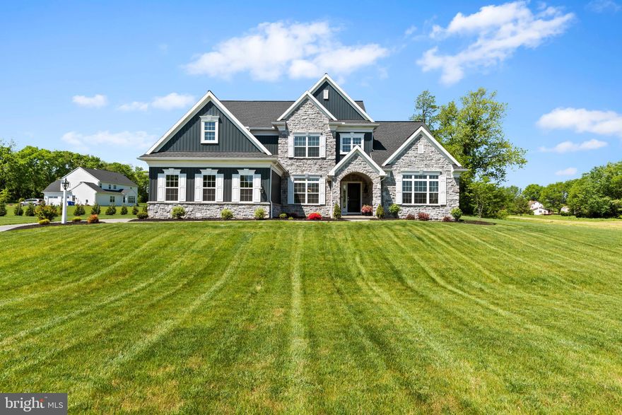 Stunning Luxury Residence located in the Brindle Farms Estates
Discover the epitome of luxury in this spectacular 4-bedroom 3.2 bath home, beautifully situated on 2.8 acres of pristine landscape in the highly desirable Cumberland Valley school district. This nearly new property offers a sophisticated blend of comfort and elegance tailored for the most discerning homeowner. 4800 square feet of total living space offers ample room for comfortable living, providing spaciousness and flexibility for various lifestyle needs, whether it be large families, entertaining guests, or indulging in personal hobbies. 
Upon entry, guests are welcomed into an environment of refined elegance, where every detail speaks of quality and style. The main floor features a luxurious primary bedroom suite with a lavish en-suite bath, offering a private retreat that promises relaxation and serenity. Also on the main level is dedicated office space, providing a quiet and comfortable environment for work-from-home days.
Central to the home’s design is the two-story great room, complete with a majestic gas fireplace and towering windows that fill the space with natural light. This room acts as the heart of the home, perfect for gathering and enjoying the warmth of the fireplace.
Adjacent to the great room, the sunroom offers a peaceful setting surrounded by panoramic views of the property, ideal for enjoying a morning coffee or a quiet afternoon with a book. This room offers a tranquil view of the surrounding woods, enhancing privacy and providing a peaceful ambiance.
The gourmet chef’s kitchen opens seamlessly into the family area, facilitating effortless entertainment with its high end GE Profile appliances, extensive counter space, and stylish cabinetry.
Experience the joy of hosting in a dining room that sets the stage for unforgettable moments. From intimate family dinners to lavish celebrations, this expansive dining room offers the perfect backdrop for creating cherished memories that will last a lifetime.
Upstairs, the home continues to impress with a versatile loft area, which can serve as an additional lounge or recreational space, along with three generously sized bedrooms, one has it’s own personal full bathroom.
Indulge in luxurious relaxation and entertainment with a custom finished basement boasting crown molding throughout, featuring an expansive rec room complete with a media area, alongside your very own personal gym equipped with infrared heaters for heated yoga providing the ultimate space for tranquility and wellness.
Conveniences include a main floor laundry and a generously proportioned three-car garage, offering ample space for parking and storage, along with room for work and organization, providing practicality and convenience for your automotive requirements.  The home is also wired for EV.
Set in a private community of just 14 homes with no through street, residents enjoy exclusive access to walking trails amidst the serene landscape. Despite its seclusion, the community is just moments from extensive shopping, dining, entertainment options, major highways, and the PA Turnpike, offering the perfect blend of country charm and modern convenience.
This property is more than just a home—it's a lifestyle. Schedule your private tour today and experience luxury living at its finest.