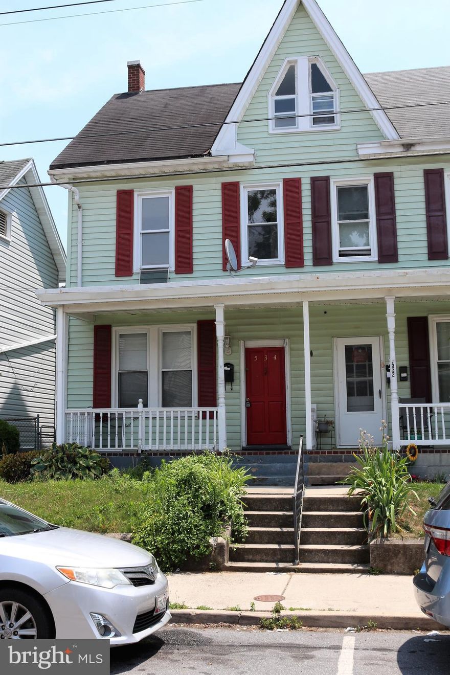 Nice half duplex with 3 bedrooms and finished walk-up attic area for additional living space.  Main level offers updated kitchen, living room, dining room with wood floors, full bath and laundry room.  Upper level offers 3 bedrooms and hall bath.  Parking in rear off alley.  Easy to show!