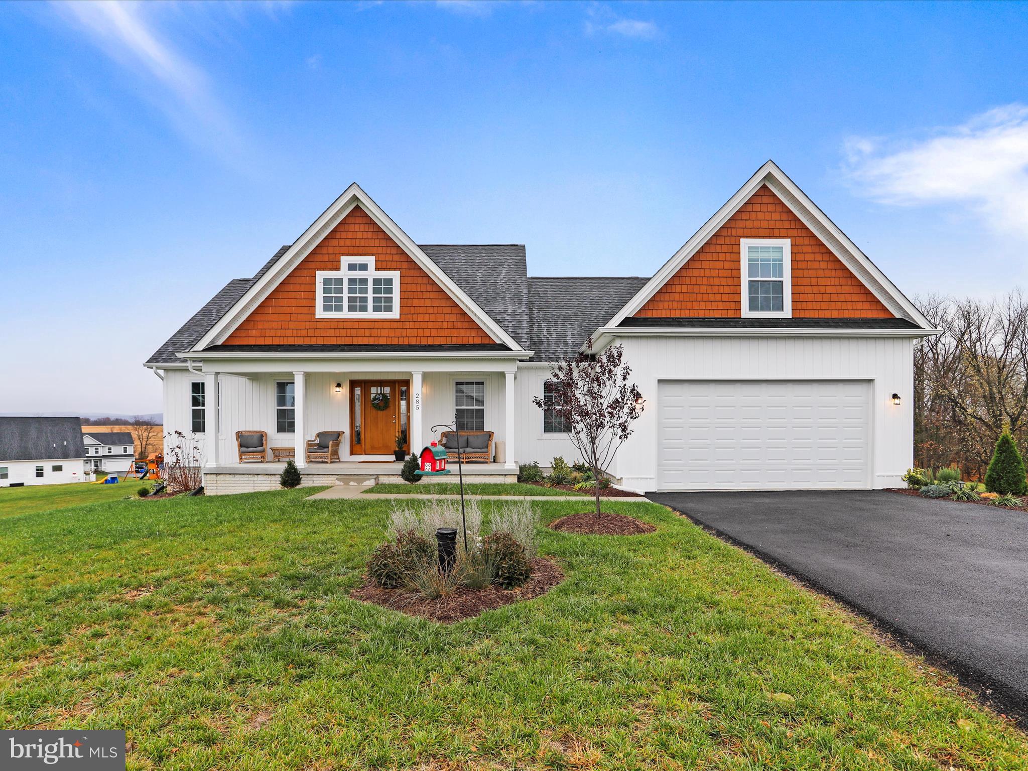 Multiple Offers received, all offers are Monday, March 10th by 2:00 PM
Gorgeous 4 Bedroom, 3 Full Bath, 1 1/2 Bath Farmhouse style home on end of cul de sac backing to trees. Beautiful white vertical siding, shingled eaves, jet black roof, wainscoting, crown molding and vaulted ceilings paired with outstanding Farmhouse architecture make this home an inviting Home Sweet Home. Nestled at the end of a Cul de Sac, and backing to the lush forest, you'll enjoy the lovely covered front porch, deck and stone patio. The lower level has a slider and level walkout to the new Stone Patio. There is so much outdoor entertaining space. With both a bit of seclusion and a sense of Community you'll experience the perfect duo and love where you live. This gorgeous Farmhouse Raised Ranch Home (Margaret Model) was built in 2023 and boasts 4 large bedrooms, 3 1/2 Baths and over 4011 Total Square feet. With an Open Floor Plan and Spacious Open Eat in Kitchen, and Family room with Gas Fireplace, the layout is livable and flows beautifully. The Master Suite (oversized master bath, double walk in closets and oversized Master bedroom) is separated from the other 3 bedrooms and baths. The Loft Bedroom (or Office Space) en-suite has a separate zoned HVAC system for a self-contained Guest Room or Office. Bring on the kids, the pets, the friends, and the grands; the custom luxury vinyl plank flooring is a dream to clean and maintain. Gourmet kitchen includes all stainless steel kitchen appliances, soft close 42" cabinets and granite counters. There is loads of natural light inside, and a spacious two car heated garage leading to a well-appointed laundry room and Pantry. Boasting a full 4011 square feet, you'll enjoy 2125 Square feet of finished living space on the first floor and loft, and 1886 unfinished square feet with bathroom rough-in on the lower-level with walk out stairs to the back yard. A total of 4011 square feet of perfectly planned living space on this one acre lot is a balance of convenience and tranquility, and is minutes from Historic Charles Town. A lovely community, you’ll enjoy peaceful morning or evening strolls, nature hikes or just wind down time relaxing on the new deck. Nearby, amble through the many retail shops, restaurants and historical buildings in downtown Charles Town just minutes away. Close to major commuter routes WV340, WV81 and MD15. You are also a quick drive to historic Harpers Ferry, Frederick, Point of Rocks and Shepherdstown. MARC Train transportation is available in nearby Point of Rocks and Harpers Ferry. A bit of History! Founded in 1786 by George Washington's brother Charles, Charles Town has a rich history that includes Jefferson County City Seat(1801), a Critical Civil War town, and an educational center of western Virginia with the founding of the Charles Town Academy for Boys in 1787. History meets Growth in beautiful Charles Town, WV!
Multiple Offers received, all offers are Monday, March 10th by 2:00 PM