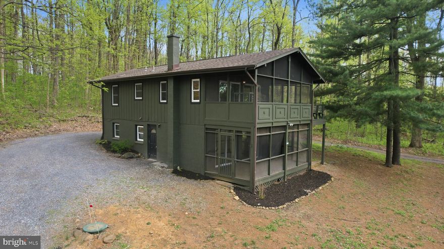 Welcome to 52 Hickory Nut Rd, a charming mountain chalet nestled on 1.08 private acres in the Blue Ridge Mountains of the Shenandoah Valley in Linden, Virginia. This 4-bedroom, 2 full bath home offers a peaceful, nature-filled setting with recent interior updates and renovations.
Inside, you will find a warm and inviting layout designed for comfortable living or a relaxing weekend getaway. The home’s standout feature is the beautiful screened-in porch—perfect for enjoying your morning coffee while taking in the sights and sounds of nature.
Surrounded by mature trees and mountain scenery, the property provides privacy and tranquility while still offering convenient access to nearby amenities and commuter routes. Ideal as a full-time residence or weekend retreat  in the beautiful Shenandoah Valley.
