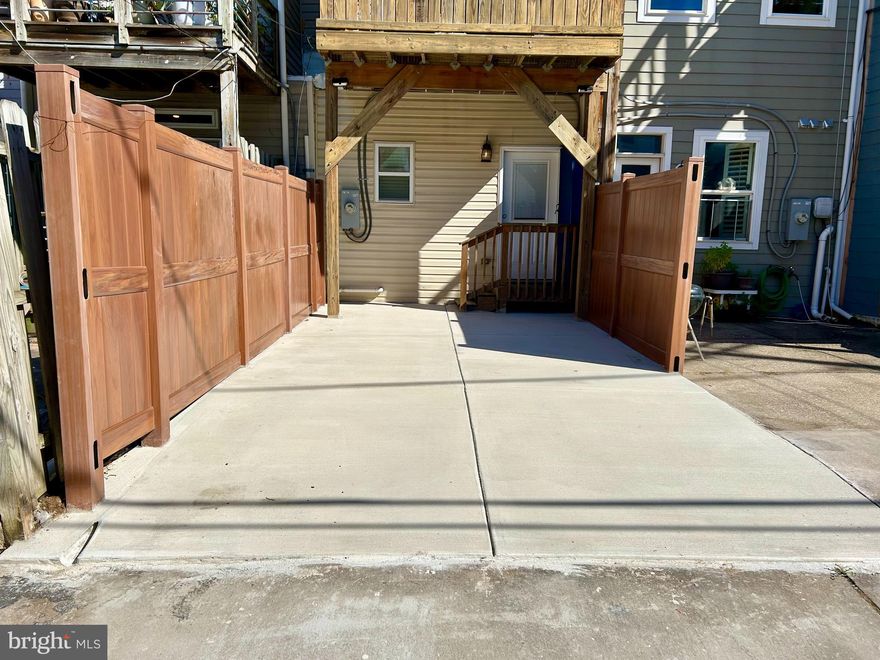 **2,000 SF of LIVING SPACE with PARKING PAD in this exceptional Riverside home just 1/2 block from peaceful Riverside Park.   Sought-after layout provides a bathroom for each bedroom - perfectly suited for multiple housemates!  Breath easy as you enter this bright home with SKY-HIGH CEILINGS on all levels! - this is not your normal cramped city row home!  Spacious Kitchen allows for multiple chefs in this entertaining utopia.  Imagine your guests delighting in the spacious indoors or visit the ROOF DECK for outdoor treats and a gorgeous view!  Upper Level features bright &  spacious Primary Bedroom with luxurious Ensuite Primary Bath, Second Bedroom with Roof Deck Access, and Full Bath off hallway.   Lower Level is Fully Finished and FULL HEIGHT.  Both rooms on LL have doors allowing for privacy and versatility of function - whether you need an Office, Home Gym, Add'l Family Room, Game Room .....you are covered!   Natural light flows generously into front-facing LL bedroom through two large windows.  Access the Full Bathroom off of hallway.   Recent updates incl: Carpet (2025), Interior Paint (2025), New A/C compressor (2025), Roof Coating (2025), Parking Pad (2025).  EASY ACCESS to 95 and commuter routes.  Riverside Park offers a plethora of recreational activities: Local swimming pool, basketball, pickleball, walking paths - a neighborhood gem!  You won’t want to miss this one!