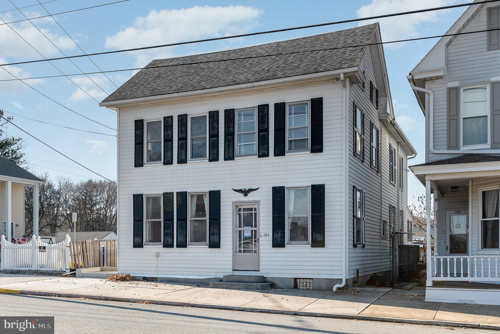 RARE FIND IN THE HEART OF DILLSBURG BORO!! This is an Amazing Opportunity to Own this 3BR 1.5 BA Detached Home with Detached 2 Car Garage, & Fenced Yard on a Corner Lot. Main Level Offers First Floor Laundry off Kitchen, Formal Dining Room, Half Bath, Living Room & Foyer. Living Room and Foyer Feature Original Hardwood Floors.  Second Floor Boasts 3 Bedrooms, Spacious Full Bathroom, Walk Up Attic for Additional Storage & Balcony Decks. Unfinished Basement Allows for Ample Storage. Enjoy the Fully Fenced Yard with Covered Porch, Patio and Covered Patio in the Back Yard. No Matter How you Look at it   THIS IS HOME!!