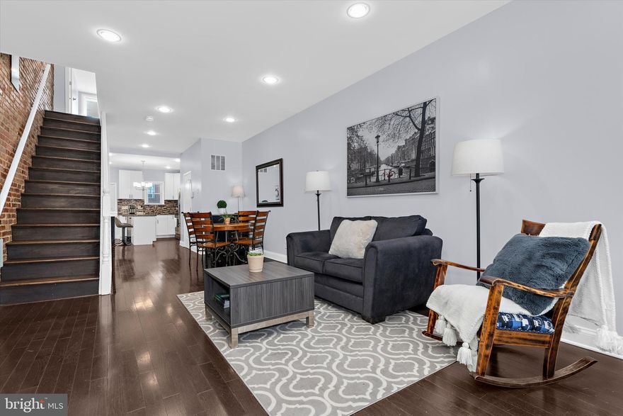 This impeccably renovated 4BR/3.5BA row-home blends classic Baltimore charm with modern luxury. The open-concept interior features signature exposed brick and a gourmet kitchen, while the finished lower level adds versatile living space. Standout features include rare dual-level outdoor living with a private second-story deck and an expansive, low-maintenance rear patio. Perfectly situated for urban enthusiasts or medical professionals, you’re steps from Johns Hopkins Hospital and minutes from the dining hubs of Canton and Fells Point. Enjoy immediate access to major highways in this sophisticated, turnkey sanctuary.