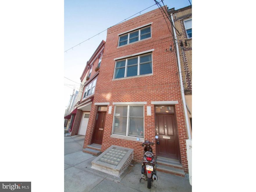 Fantastic 3 bedroom, 3 bath bi-level condo unit in a prime location at Bella Vista/Queen Village borderline in the Meredith Catchment. One of just two units in the building, this property begins with a tile foyer entry with an exposed brick wall and steps up to the second floor. Step into this unit's beautiful, wide open, sun-filled living room, dining room and kitchen space with triple front window and hardwood flooring. The handsome kitchen offers granite countertops, stainless steel appliances, and an island bar counter. Next you'll find a full bathroom with tile floor and stall shower. Small bedroom offers two windows and a closet. Steps lead up to third floor where you'll find a bedroom suite with triple window, two double closets and a spacious en suite bathroom with stall shower, Jacuzzi type tub and vanity with granite countertop. This level also features a single bedroom, a full bath and a laundry/mechanical room. Hardwood steps lead up to the rooftop where you'll enjoy a very large deck with incredible sunrise to sunset views of the entire Center City skyline plus bridges! The building was completely renovated in 2005. Located right at the Passyunk triangle, convenient to coffee shops, restaurants, South St, parks and transportation.