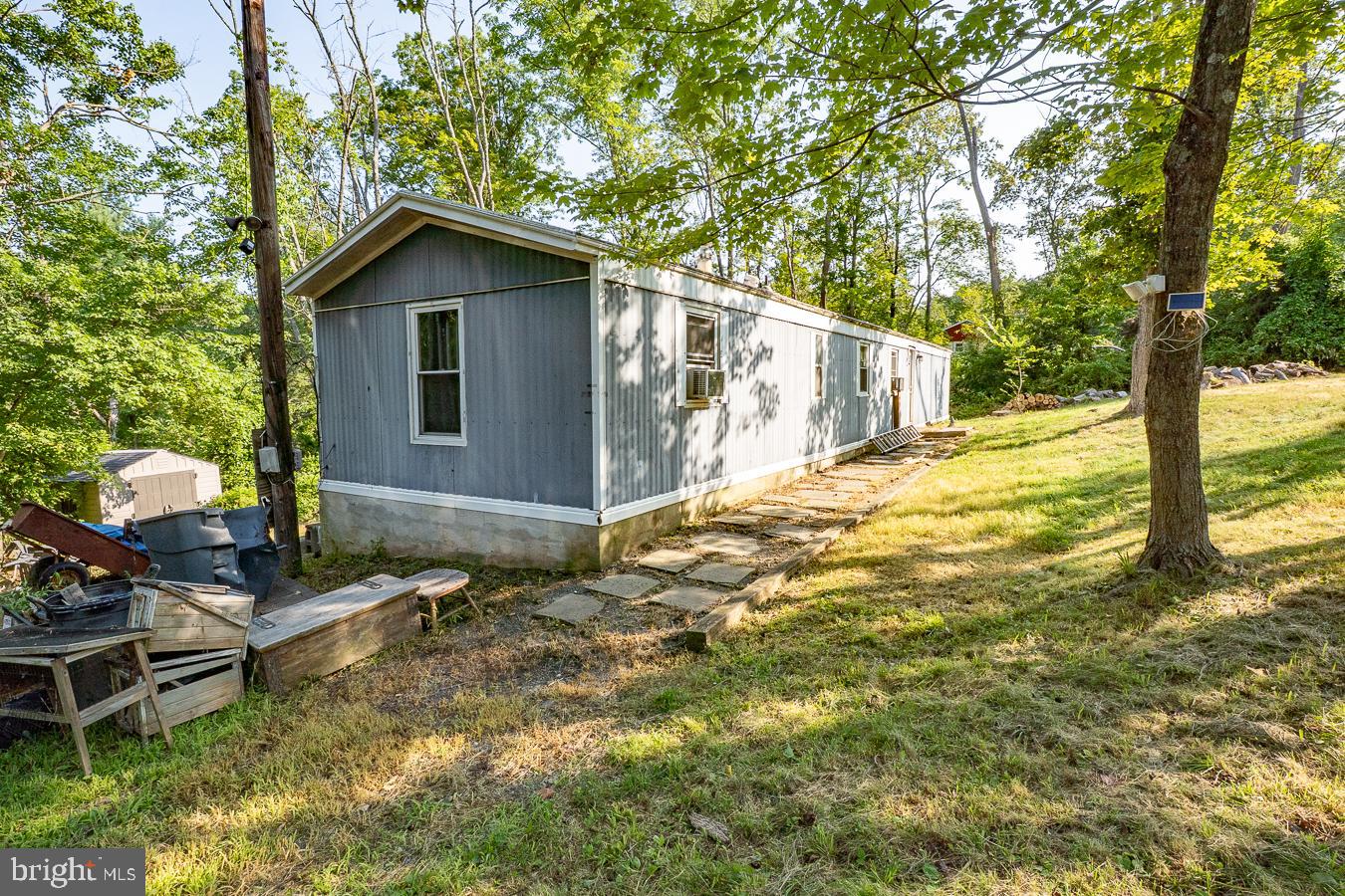 Investor Alert or Handy Homeowner Special!
Located in the Pottsgrove School District, this 3-bedroom, 1-bathroom single-wide mobile home sits on a spacious 0.86-acre lot, offering a rare opportunity to build equity or start fresh. Tucked away on a quiet street and surrounded by mature trees, this property provides both privacy and potential.
The home is in need of significant TLC and is being sold as-is, where is. Making it ideal for investors, contractors, or anyone looking for a project or you can choose to remove the home and build new to suit your needs!
Don’t miss your chance to own nearly an acre in a sought-after area with low taxes, close to schools, shopping, and major routes.
Bring your imagination and your tool belt — the possibilities are endless!