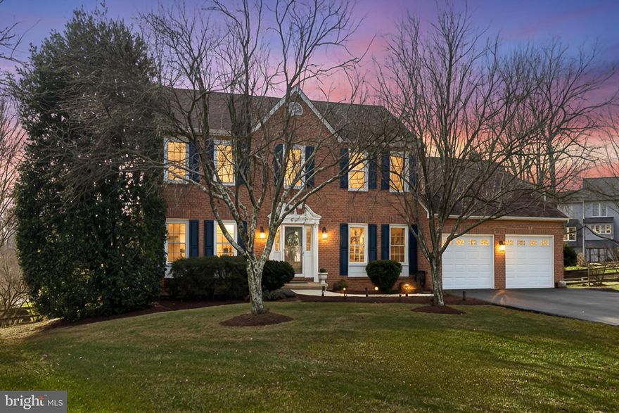 This beautifully updated and meticulously maintained brick-front colonial, proudly offered by the original owner, is tucked away on a quiet cul-de-sac in the highly sought-after Virginia Run community. The expansive home offers over 4,000 finished square feet with 5 bedrooms, 3 full baths, and 1 half bath on a generous 1/3-acre lot.
The home showcases exceptional custom details throughout, including designer paint, custom moldings, built-ins, and exquisite drapery that conveys. The custom chef’s kitchen features 42" cherry cabinetry with glass display cabinets, granite countertops, a maple coffee and wine bar, and charming cherry banquette seating with built-in storage. From the kitchen, step out onto a private and peaceful deck overlooking the fully fenced backyard—perfect for morning coffee or outdoor dining. The dramatic family room boasts a vaulted ceiling, skylights, a hand-painted gas fireplace surround, custom mantle, and built-in shelving and cabinetry, and opens to a bright, sunny sunroom with tiled flooring, vaulted ceilings, skylights, and a stunning Palladian window. The home’s desirable east/west orientation fills the interior with an abundance of natural light throughout the day.
Formal living and dining rooms provide elegant entertaining spaces, with the living room highlighted by a hand-painted accent wall and the dining room featuring a new chandelier. A main-level office offers custom cherry built-in cabinetry with dual workspaces, adjustable shelving, and integrated power—ideal for today’s lifestyle.
Upstairs, the vaulted primary suite features skylights, a walk-in closet, and an updated en-suite bath with soaking tub, spa shower, and built-in makeup mirror. Three additional bedrooms share an updated hall bath with double-sink vanity, including one truly special bedroom featuring bold custom graphic paint and built-in shelving and bookcases.
The walk-out lower level includes a spacious recreation room with a stunning white-washed brick accent wall, access to a slate and brick patio, a full bathroom with shower, and a private fifth bedroom with an adjoining office—perfect for guests or multi-generational living. A dedicated craft and utility room features cabinetry with overhead storage and offers a wonderful space to create and organize your treasures.
Thoughtfully landscaped perennial gardens, featuring blooms such as hyacinth, roses, peonies, coneflowers, purple bearded iris, lilac, candytuft, creeping phlox, and coral bells provide seasonal color and beauty throughout the year.
Additional highlights include a fully insulated two-car front-load garage with drop-down stairs providing easy attic access, an abundance of storage throughout the home especially in the lower level, and important system updates including upgraded siding, protected gutters, roof (2017), A/C (2017), furnace (2022), hot water heater (2021), sump pump (2021), gas logs (2019) and dishwasher (2026).
Enjoy all that Virginia Run has to offer with a community pool, tennis and pickleball courts, walking trails, basketball court, two playgrounds, and an active social calendar.  Welcome Home!
Available for private showings beginning February 5th. Public Open Houses:  Thursday, February 5th 5:00-7:00pm &  Saturday, February 7th 1:00–3:00 PM.