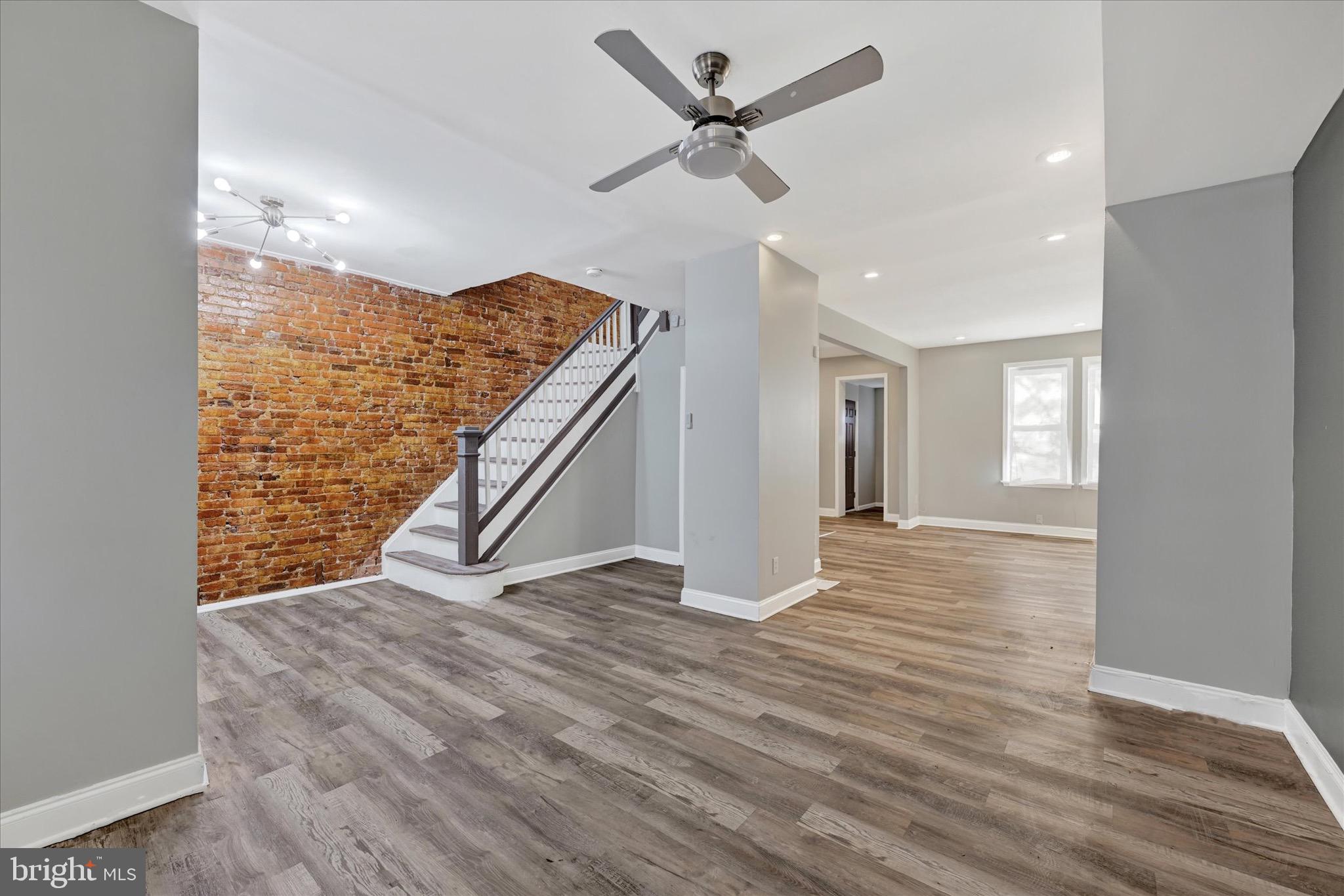 Gorgeous rowhome in the city - move-in ready! This charming 4 bedroom, 2 full bath home has great living space on every level! Entertaining is easy with the open floor plan on the main level, featuring luxury vinyl plank flooring, recessed lighting and modern touches throughout. The upper level features 4 bedrooms, full bathroom and convenient washer and dryer area. The lower level is finished and perfect for a game room or home movie theater with a second full bathroom! Enjoy morning coffee on the front covered porch or BBQs in the backyard. Both front and backyard are fully fenced in making it perfect for gatherings and pets! Recent updates include a new roof, new kitchen cabinets, refrigerator and stove, and new electrical service and cable installation!