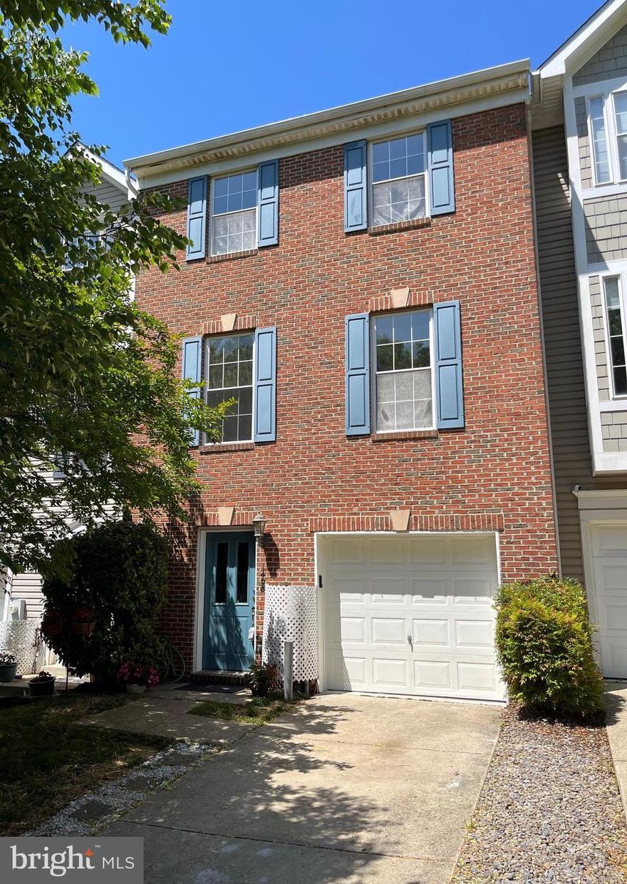 Wow!  We are back on the market with brand new Outlast+ Waterproof Pergo floors! Out with the carpet and vinyl!  New flooring  just installed on entire middle level!  This space is just so elegant and classy! Now is an even better time to put a  new roof over your head...a brand spanking new roof! New gas furnace & CAC July 2022. Water heater replaced 11/2019, DW replaced about 3 years ago.  Entire home has been professionally painted in a soft neutral color.  This brick faced beauty is stacked in the back with a 3 level bump out adding considerable  living space! Just under 2,400 sq. ft. of finished living space not including the 220 sq. ft. in the garage! There is a large multi-use recreation room on the main level with good natural light and enough space for a separate home office or craft/hobby area. The entire 2nd level is graced with 9' ceilings. The living room and dining room flow together in contemporary style.  Guest bathroom, pantry, open railing staircase. There is room for a table in the kitchen plus a bright window encased multi-use room with a sliding glass door for easy access when you add a deck.  Upstairs you'll find 3 bedrooms and 2 bathrooms.  Super size main bathroom has a double sink, soaking tub and separate shower. Main bedroom has vaulted ceilings and a walk-in closet.   Decks are allowed!  Reasonable condo fee covers front and back yard maintenance.  And talk about location! You have your choice of shopping centers...Bay Hills or Cape St. Claire...with great restaurants and services. Broadneck Library, Broadneck High School, Broadneck Park (with doggie fun time facilities) all easily accessible via the Broadneck Peninsula Trail.  Phase III of this wonderful community asset is now under construction connecting with AACC and the B & A Trail.