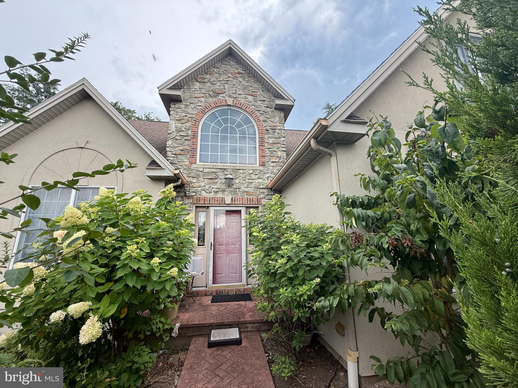 Welcome to this two story traditional home in Beacon Hill with so much opportunity! The home has lovely curb appeal with its stone and brick accents and winding brick walkway which leads to your front door. The two story foyer makes a statement as you walk inside the home as does the bridge overlooking the two story family room. On the first floor is a formal dining room, eat-in kitchen, family room with vaulted ceilings, and a primary bedroom suite with large corner soaking tub. Right off the kitchen are steps to an elevated, multi-tiered sunroom that overlooks your semi-private and beautiful backyard with a patio. There are two more bedrooms and another bathroom on the second floor, plus a spacious walk out basement with another full bathroom. Situated on a corner lot, this home has a side entry garage plus a private paved driveway. Conveniently located close to the PA Turnpike, Routes 83, & 581 and a short drive to the East Shore, this home just needs some TLC to bring it back to life!