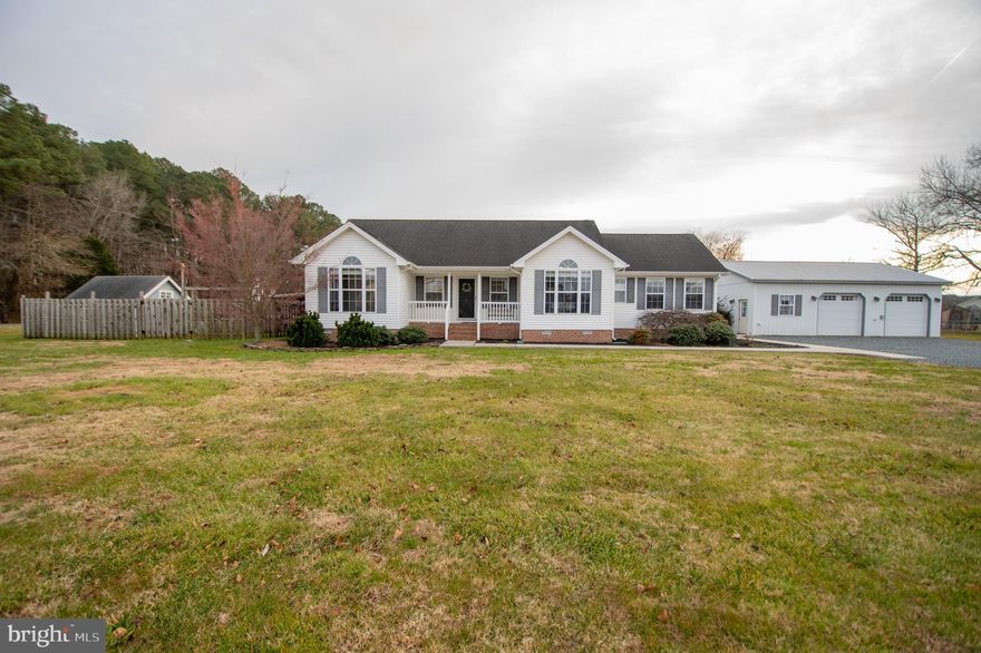 Welcome to this spacious 3-bedroom, 2-bathroom home located in Princess Anne, Maryland, offering a versatile layout and exceptional outdoor amenities. Inside, you’ll find a large kitchen with a breakfast bar that opens to a formal dining room, perfect for everyday meals or hosting gatherings. The living room features vaulted ceilings and a sliding glass door that leads to a screened-in porch, creating a seamless connection to outdoor living. The primary suite offers a relaxing retreat with a soaking tub and walk-in shower, while two additional bedrooms share a full hall bathroom. Outside, the property truly shines with an oversized detached garage complete with a partial kitchen and full bathroom—ideal for hobbies, entertaining, or additional workspace. The fully fenced backyard includes an above-ground pool, a charming playhouse with electric, and two additional sheds for extra storage. This property offers space, functionality, and endless possibilities, all in a convenient Princess Anne location.