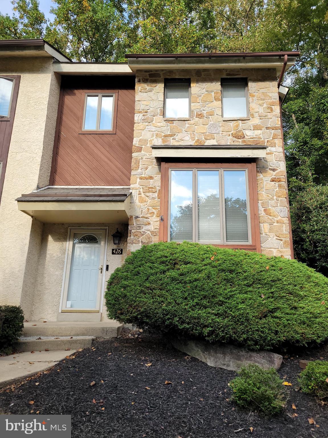 Welcome to 426 Heatherwood Drive – This beautiful home was upgraded where the owner spared no expense and has it meticulously maintained throughout. Experience an opportunity to own a spacious and rarely available end unit townhouse backing up to a serene wooded area in the highly sought after subdivision of Granite Run. The first level provides open and airy space beginning with the expansive living room, which has a large picture window set deep, to allow placement for plants or cherished possessions. There is also a side window which benefits this room. The deluxe vinyl plank flooring leads to a ceramic tiled hallway taking you to a completely upgraded powder room and then to a cozy, fireside family room with wood burning fireplace. This same space opens to the spacious dining room which has a sliding door opening to a comfy rear deck offering relaxing wooded views. The deck area also includes a large storage closet. Directly adjacent to the dining room is a fully upgraded Smart Gourmet Kitchen with ceramic tiled flooring, deluxe quartz counter top and smart appliances. The built-in range has an induction stove top that mimics the convenience of gas cooking. The convection oven has many features to satisfy any gourmet chef and novices as well. The dishwasher also has smart features. In addition to these high end appliances, there's also a French door refrigerator, under mount stainless steel sink, built-in microwave and a garden window. The staircase taking you to the 2nd & 3rd Floor has been upgraded with premium hardwood flooring and also features a built-in clock and skylight brightening the surrounding areas. On the 2nd floor experience hardwood flooring throughout the hallway and in all 3 bedrooms; also there is a full bath and laundry area. The primary suite is spacious and features a cathedral ceiling with dual skylights, a walk-in closet and fully renovated primary bath with tiled flooring and large walk-in tiled shower. The 2nd bedroom features a walk-in closet and the 3rd bedroom features a sliding door to the rear balcony deck overlooking a serene, wooded area. The full bath was also completely renovated from top to bottom. It features tiled walls, flooring, upgraded fixtures, vanity, tub and toilet as well. The laundry area has a spacious storage area and also features a state of the art, Smart stacked Washer and Dryer with extra added features not found on many appliances. The 3rd story features a rarely available large 4th Bedroom that has a vaulted ceiling, dual skylights, ceiling fan, upgraded wall to wall carpeting, a walk-in area which could be purposed for many uses and access to attic storage. Additional features include numerous renovations and upgrades as recent as June 2025, LED lighting, crawl space storage, a ceramic tiled entry foyer and more! There is an assigned parking space with plenty of additional parking available. Located in the heart of Middletown Township, near Riddle Memorial Hospital, the Granite Run Promenade, and Franklin Station Regional Rail Station. This residential community is a hidden gem offering a park-like secluded setting, yet located within easy commutes to Wilmington, Philadelphia, Newman University and downtown Media. Schedule a showing today and experience this amazing “rare find” property in an excellent location!