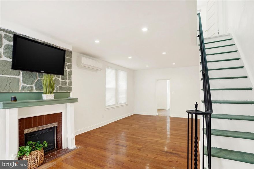 Discover this beautifully maintained twin home located in the heart of Philadelphia's desirable Olney section. This spacious residence features two bedrooms, one full bath, and an additional finished room in the basement-perfect for a home office , gym, or guest space.  The main level offers an inviting open layout with a fireplace and a bright living room that flows seamlessly into the formal dining area.  The Eat-in kitchen is beautifully updated with granite counter tops, a new stove, and newer windows overlooking your cozy vinyl-fenced privacy yard-a perfect retreat for relaxing or entertaining. For added comfort, this home includes a ductless split A/C and heating wall unit, ensuring year round convenience and energy efficiency. Don't miss this opportunity to make this charming Olney twin your new home-schedule your showing today!