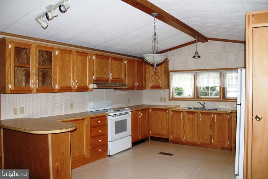 *55+ Community (Newer) *Extremely Well Kept Community. *Covered Porch *Shed *Includes Washer, Drier, & Refrigerator *New Flat Top Range *Eat in Kitchen w/ Breakfast Bar *Lot Rent :$300; includes: Water, Sewer, Trash, & Snow Removal.  *NO DOGS! *Subject to Park Approval