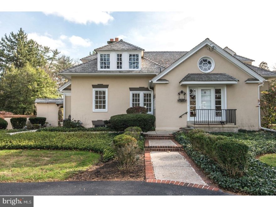 Welcome home to 717 Mount Moro, an exquisitely remodeled carriage home on the Mainline!  This 4 bedroom, 2.5 baths charming home is light-filled, spacious and luxurious.  Enter the welcoming circular drive with gated motor court and established plantings.  The front door opens to the dramatic slate foyer with vaulted ceiling which leads to a grand step down living room with beamed ceiling, polished hardwoods, large windows and full brick walled fireplace.  The adjacent dining room is open, great for entertaining with French doors that spill outside to the covered dining area  great for al fresco dining. The kitchen is outfitted for the creative cook,with beamed ceiling, stainless range and hood, Corian tops, imported tile floor, cozy breakfast nook, and the attached, huge butler's pantry with corner fireplace, is great for entertaining as well as everyday living. Also, on the main level you will find the powder room, laundry room and wine bar with sink and access to the patio. Upstairs the divine master suite presents a large Palladian window, large closets, an opulent en-suite bath with double shower and water closet. Wake up each morning to awe inspiring sunrises from your master bedroom balcony overlooking the pool.  Upstairs also boasts, three additional bedrooms, hall bath, an office, all filled with fine craftsmanship and architectural charm.  Outside, brick surrounds the gorgeous pool - the focal point of outdoor entertaining and the perfect compliment to this beautiful home.  This property is situated in a friendly community with award winning Lower Merion school system, perfectly located close to restaurants, shopping, and the train-minutes to downtown. Practical amenities include, security system, electronic gate and a full size gas-fired house generator that will run the entire house when needed.