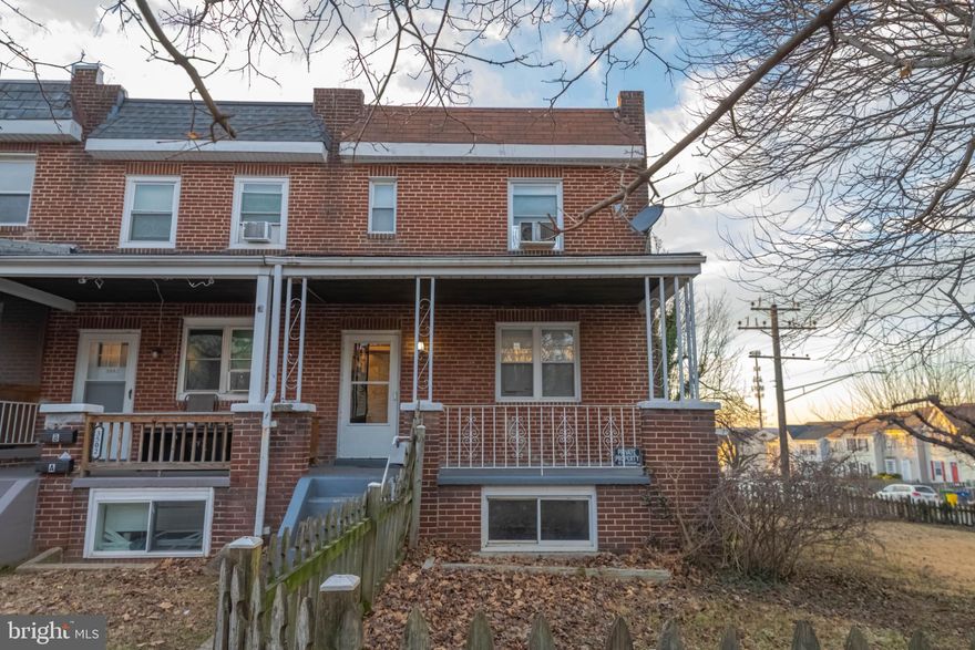 End-unit brick townhome offering flexibility, space, and strong investment potential. The home is currently configured as two separate living areas, making it well-suited for investors, multi-generational living, or buyers seeking income potential.

The upper level features a one-bedroom, one-bath layout with kitchen, dining, and living room areas, creating a comfortable and functional apartment-style setup. The lower portion of the home spans two levels, with a basement level that includes a kitchen/dining area, full bath, laundry, and utility room. The level above offers two bedrooms and a living room accented by a wood-burning stove.

Hardwood floors add character throughout, and radiator heat provides consistent warmth. The property includes a covered front porch, a fenced yard (fence in need of repair), and a rear parking pad, along with available street parking.

With its end-unit location, brick construction, and versatile layout, this property presents a solid opportunity for investors or buyers looking for adaptable living space with long-term potential.