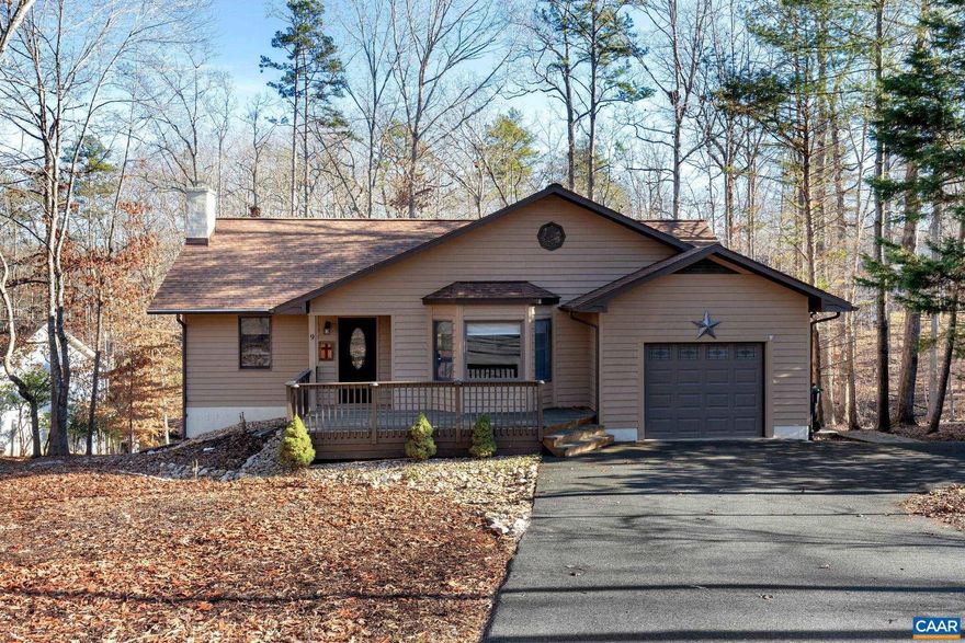 WATER FRONT/VIEWS.Imagine the perfect second home, or primary residence with water access (approx 10?), water views and THREE bedroom suites. This home has been tastefully remodeled and updated for the most discriminating buyer. Main level offers updated kitchen with quartz countertop, stone backsplash and all newer black stainless appliances, large pantry, dining area and large great room. The Primary bedroom includes  a large walk in closet, remodeled bath to with tiled shower and soaker tub  and offers access to the screened porch with water views. The main level en-suite also has a walk in closet and updated bath with tiled shower. There is a large deck off the dining area with wonderful main water views and access to the screened porch. Lower level offers a third bedroom w/ensuite, exercise area,large family room, storage and access to the extensive lower deck and beautiful hardscaped patio.  Whether you decide to make Lake Monticello your permanent home, or your "home away from home" this property offers views AND access to the Lake and all the additional amenities we have to offer. Bring your Kayaks, canoes, paddle boards, fishing poles whatever water activity you enjoy.,Painted Cabinets,Quartz Counter,Fireplace in Basement