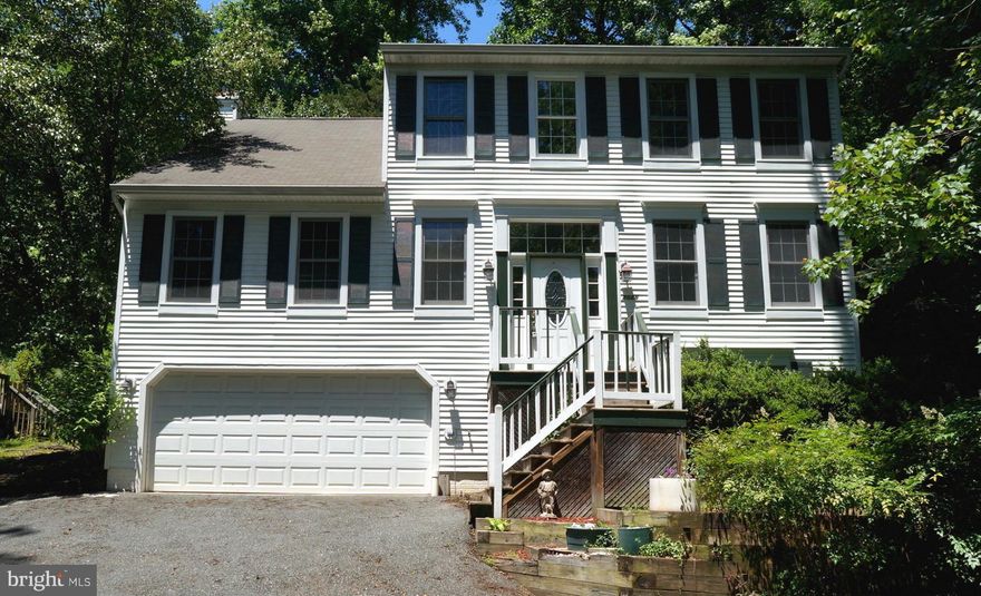 MAKE OFFER! LOWEST PRICED 5BR in ALL of 22554! 2 NEW A/C Units! Great Value! Home w/ 5BRs & 3.5BA + 3 Fin Lvls! Hardwood Flrs, Granite, Vaulted & Cathedral Ceilings, Stainless Steel Appls, Laundry Rm w/ Cabinetry & Pullouts, Skylight, MBA Tub & Sep Shower. Uphill driveway not bad after driven couple times + Parking Pad at Street w/ Steps to House. Low Maintenance, Terraced Yard w/ Large Rear Deck.