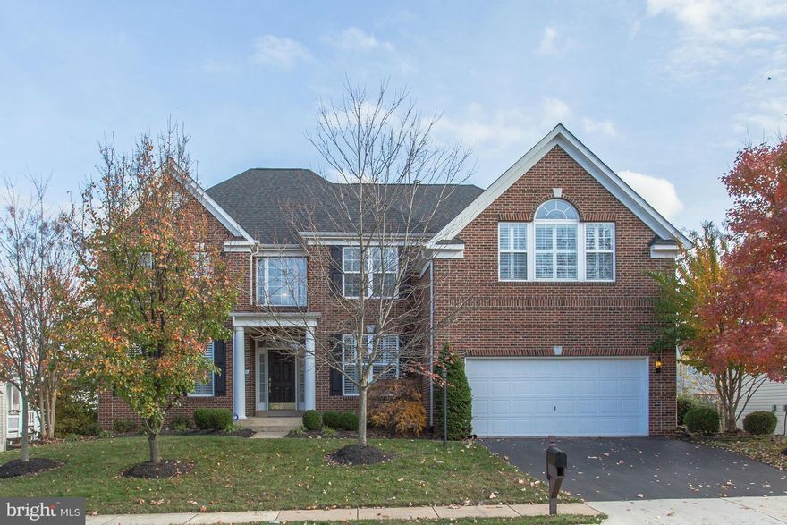 Beautifully appointed home w/2 Ft Ext, 6 Inch Brazilian Cherry Flooring, Soaring family room w/2 story stone FP, Gourmet Granite & Cherry Kitchen. Arched entryways, dual staircases, Custom plantation shutters, Loaded with Custom Upgrades and touches. Barely used walk out basement w/media room. Tiered, lighted deck w/trellis, patio, stone walls, professional landscaping surrounds the home. Perfect!