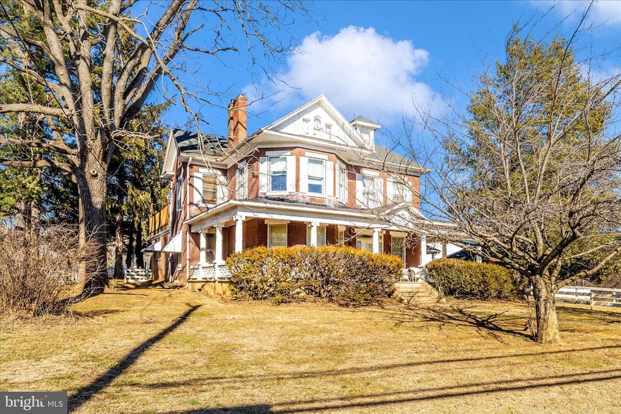 They just don't build them like this anymore!  Come check out this GRAND home on nearly THREE acres OUTSIDE CITY LIMITS!  The main level of this all brick beauty includes: foyer, living room with fireplace, separate dining room, kitchen, full bath, laundry room, primary suite with full bath and connecting private den / study / home office.  Upstairs you will find the original hardwood floors, FOUR more nicely sized bedrooms and a THIRD full bath!  One of the bedrooms leads to a HUGE private deck overlooking the backyard.  The walk up attic provides potential for MORE finished living space OR a ton of storage.  PLUS a basement for more storage / living needs.  Outside an attached carport provides covered parking, a detached two car garage for enclosed parking.  Large barn two level offers more possibilities: animals (as allowed by the county), workshop, entertaining, home gym....the possibilities are endless.  AND a milking shed that would make the best she shed, man cave, potting shed, garden shed, chicken coop...again - use your imagination! This home and property offer endless potential and possibilities.