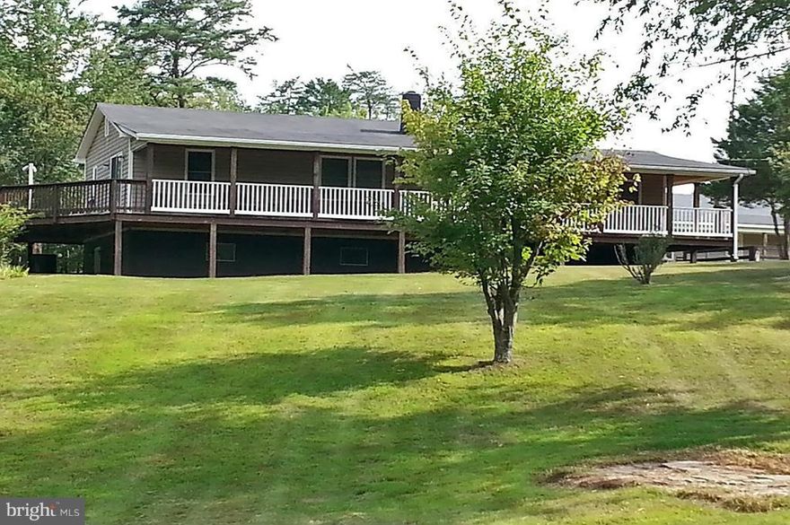 Secluded 2000+sqft ranch house with partially finished walkout basement w/ 12+ acres. Renovated 2003. Wraparound porch w/ fantastic mtn views. Approx. 3 open acres around house and approx. 9 acres wooded. 20x48 tractor shed with concrete floor. Hunting and farm animals allowed. This would make a perfect farmette. Furnishings convey except dining room table.