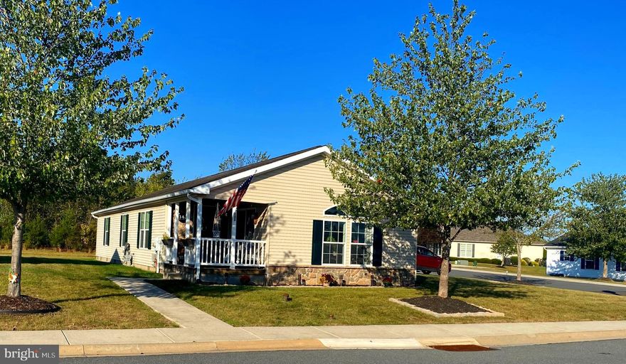 Welcome to 145 Random Road, where comfort, style, and low-maintenance living come together in the heart of the sought-after 55+ community of Douglass Village.  This beautiful Fern II model features 3 bedrooms, 2 full baths, and a two-car garage, designed for both relaxation and convenience.   From the moment you arrive on Random Rd, you will love the curb appeal of this large corner lot .  To enter the home, you will step up onto a lovely covered front porch - the perfect place to relax & enjoy your morning coffee while soaking in the peaceful outdoors.  Entering you will be entertained by the open, airy floor plan.  The formal living room offers flexible space—whether you use it for a cozy reading room or additional sitting area for entertaining, the choices are limitless!  At the heart of the home is the bright and ample kitchen with beautiful, recycled quartz counter tops, lots of cabinets, a Samsung Gas stove and Samsung Dishwasher both with Smart Home Connection.  The kitchen opens to dining area which flows into the expanded family room which gives you even more space to relax, unwind, or gather with loved ones!  The primary suite situated at the back makes it truly relaxing, complete with a walk-in closet and an en-suite bath with soaking tub. Two additional bedrooms and a second full bath offer plenty of space for guests, hobbies, or whatever suits your lifestyle. The laundry area is positioned right off the kitchen with a built-in shelving for extra storage—because convenience matters!  The  two-car garage isn’t just for parking; it has plenty of space for extra storage.  Douglass Village not only offers this fabulous home, but it also offers incredible amenity. For starters, a welcoming clubhouse that features entertainment area with full kitchen, fitness center, library, heated outdoor swimming pool... all steps away from home!
The lot lease covers lawn care, trash removal, and snow removal on streets and sidewalks—giving you more time to enjoy the low-maintenance lifestyle this community offers.  This is more than just a house, it’s a home designed for comfort, convenience, and connection. Don’t miss your chance to make it your schedule a showing today!