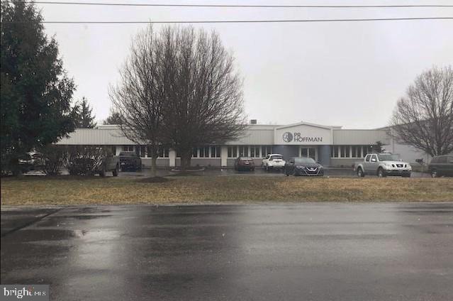 Detached industrial building contains 4800 sq. ft. offices and 16,800 sq. ft. warehouse / manufacturing. Metal exterior with clear span steel frame construction - 18' ceilings. Entire building heated and cooled. 55 parking spaces. Dock doors and 2 cranes (1 ton). Lease possible at $12,000 / month NNN. Posession negotiable. Will accomodate a 6,720 sq. ft. addition (56x120). Seller financing possible.