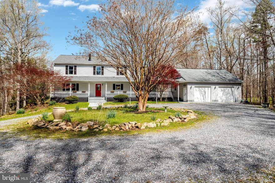 This charming Farmhouse style home has an amazing wrap-around porch that lends to a perfect view of the wildlife to include many types of birds, deer, fox, squirrels, raccoons, turkey and even a bear once in a while.  Enjoy 10 private acres of walking trails and creeks that run throughout the trees perfect for walking, biking or even a 4-wheeler in your backyard. Plus, the Orlean Community Trail System connects directly to the property which expands the trails for miles.  Once you step inside, you will be wowed by the 2-story Great Room featuring vaulted ceilings, gorgeous pine wood trims with a floor to ceiling stone fireplace.  Overlook this beautiful space from the upper level loft perfect for an office.  Enjoy cooking in the open spacious kitchen with brand new appliances! The owner's suite is on the main level, and features a jacuzzi tub.  On the upper level, there are additional 3 bedrooms and the loft that  have brand  LVP and new carpet, plus 2 more full baths.  Updates include a NEW roof, pressure tank, water heater and UL HVAC plus so many extra details throughout. The lower level provides a wood stove, extra storage, recreation space and workshop plus walk out access to the back yard.   There is a 10ft  breezeway that connects to an over-sized detached 2-stall garage, plus there is separate shed and carport.  Chickens, Goats, Sheep and Horses are welcome.  Generator and Starlink Internet Package convey!!! To tour this home call today!