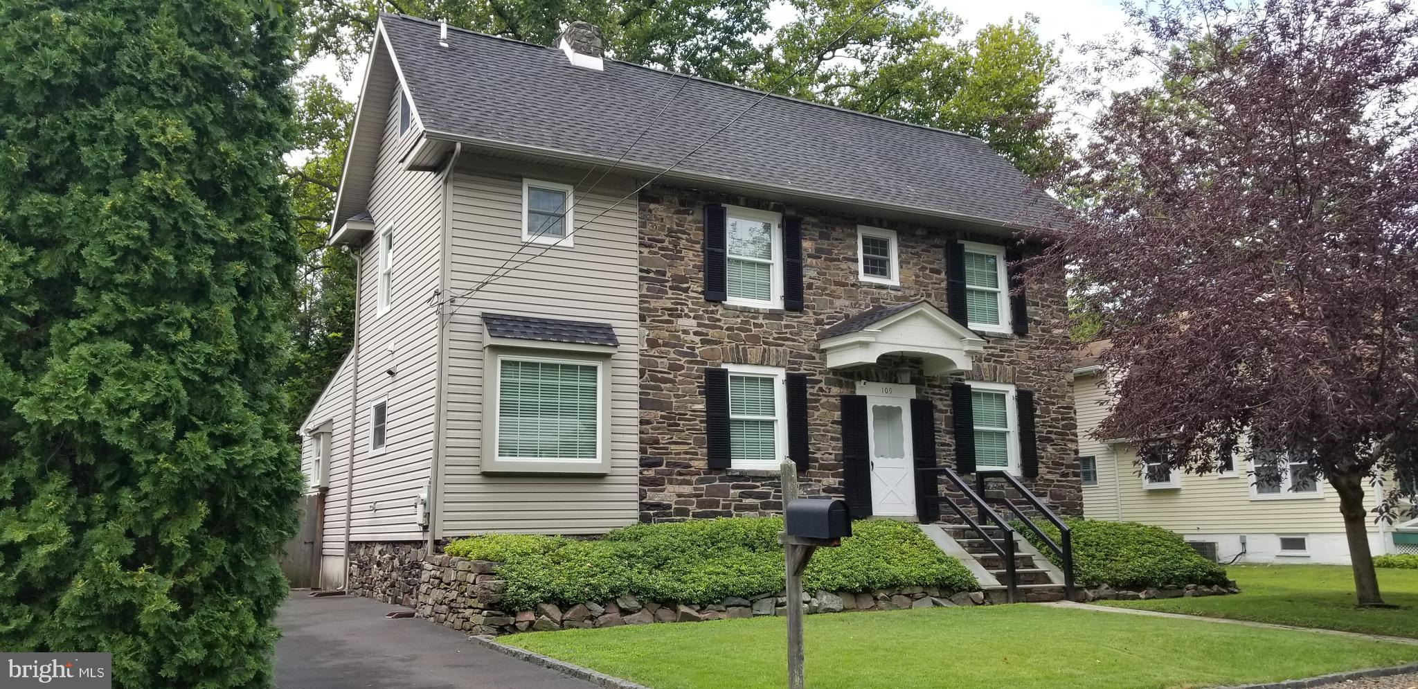 This unique stone colonial home in quaint  Yardley Borough combines old world charm, classic character and craftsmanship along with modern conveniences. Quality construction is clear to see and upon entry you will observe the fine materials used in the detailed appointments throughout.  As you enter the front door there is a small mud room perfect for wet shoes, umbrellas and package delivery. The centrally located staircase is flanked by the dining room with functioning wood burning fireplace and the living room both with wide plank pine floors, crown moldings and large replaced windows which provide an abundance of natural light. Additions to the historic portion of the home provide tremendous  enhancements to the living space as seen by the remodeled eat in kitchen completed in 2015  featuring granite counters, custom cabinetry with decorative glass panels, stainless steel appliances, vented range hood and under cabinet lighting. Offering a truly unique character to the kitchen is the exposed  original natural stone wall with customized lighting. The large family room addition at the rear of the first floor provides the ultimate expansion of functional space. The stone work once the exterior of the home became the interior wall with this renovation with customized lighting.  Additional features in this unique room include custom built in full wall unit, lighting, built in window seat and a natural gas on demand belly stove. A large pantry, half bath, coat closet and doors to outdoor deck complete the first floor. Upstairs the master suite with updated ensuite bathroom provides access to third room with options for use as home office,study or nursery.  An additional bedroom on this floor includes staircase to unfinished full size attic which could be  renovated to add  another level of living space and  updated hall bath nearby. Dual zone central air and natural gas heat, water prevention French trench drain system  in basement, plenty of parking, fenced in yard and shed complete  this exceptional property. Enjoy the close proximity and walking distance to Yardley borough restaurants and shops, the Delaware River and recreation along the canal path. Conveniently located for commuters to highways and train stations to New York, New Jersey or Philadelphia and within Pennsbury School District Flood insurance is required however the property has never flooded  during current ownership and the house sits on one of the highest points in the neighborhood.