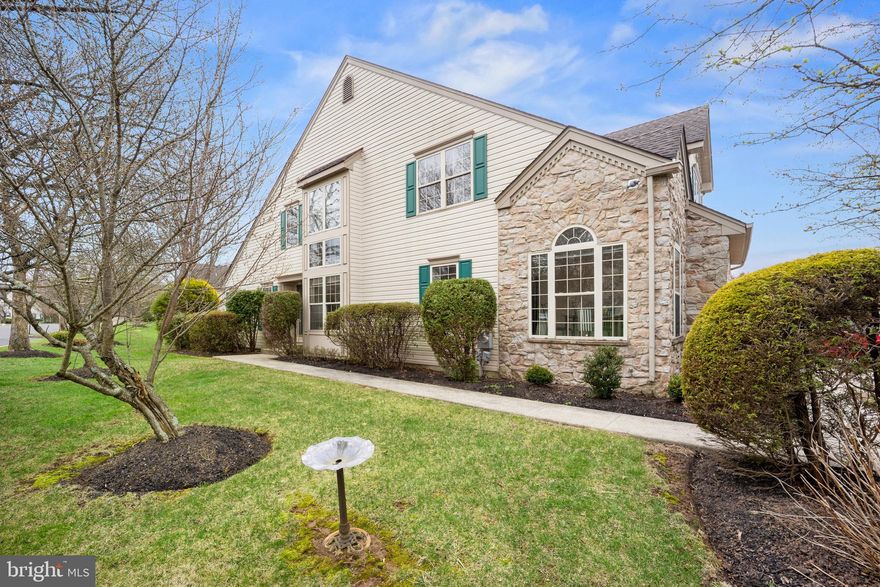 Welcome to this rarely offered “Nockamixon” model end-unit townhome, ideally located on a cul-de-sac street in the highly sought-after Fireside community of Buckingham Township. This elegant residence features the convenience of a first-floor owner’s suite, and the majority of the home has been freshly painted throughout. A walkway from the double driveway leads to a private side entrance and into a dramatic two-story foyer, showcasing refinished hardwood flooring that continues into the living and dining rooms. A gracefully curved staircase with new carpeting overlooks the space and leads to the second level. The spacious living room is highlighted by a vaulted ceiling and a wood-burning fireplace with a raised slate hearth and classic wood mantel. The adjoining two-story dining room is filled with natural light from a stunning wall of floor-to-ceiling windows, creating an inviting setting for both everyday living and entertaining. The updated kitchen features newly installed quartz countertops, an undermount stainless steel sink, a new faucet, and a full suite of GE stainless steel appliances (2026), along with recessed lighting, refinished hardwood flooring, and a pantry. The adjacent breakfast room, with its cathedral ceiling and abundant windows, offers the perfect spot to enjoy morning coffee.  A hallway off the kitchen leads to a stylishly updated powder room with quartz countertops, a convenient first-floor laundry room, and direct access to the oversized two-car garage.  The first-floor owner’s suite is a true retreat, featuring a vaulted ceiling, new carpeting (2026), a walk-in closet plus an additional double closet, and sliding glass doors that open to the rear deck.
The Primary bathroom includes a whirlpool tub, a walk-in shower with ceramic tile, a new quartz vanity surface, and diagonal ceramic tile flooring.  Upstairs, the open loft area with new carpeting and recessed lighting offers flexible space for a home office, lounge, or recreation area. Two generously sized bedrooms—both freshly painted with new carpeting—are serviced by a full hall bath with updated quartz vanity and linen storage.   The large unfinished basement can be used for extensive storage or finished for additional living space.  The roof was replaced in 2011! Ideally situated within walking distance to Hansel Park, offering trails, sports fields, and play areas, and just minutes from additional parks, including Bush, Holicong, and Central Park. Enjoy the proximity to historic Doylestown Borough with its renowned dining, shopping, museums, and cultural attractions, as well as convenient access to the SEPTA train station and major commuter routes to Philadelphia, New Jersey, and New York. Nearby destinations such as Peddler’s Village, New Hope, the Delaware River, and the Pocono Mountains further enhance this exceptional location. 
This is a rare opportunity to own a beautifully updated home in one of Bucks County’s most desirable communities
