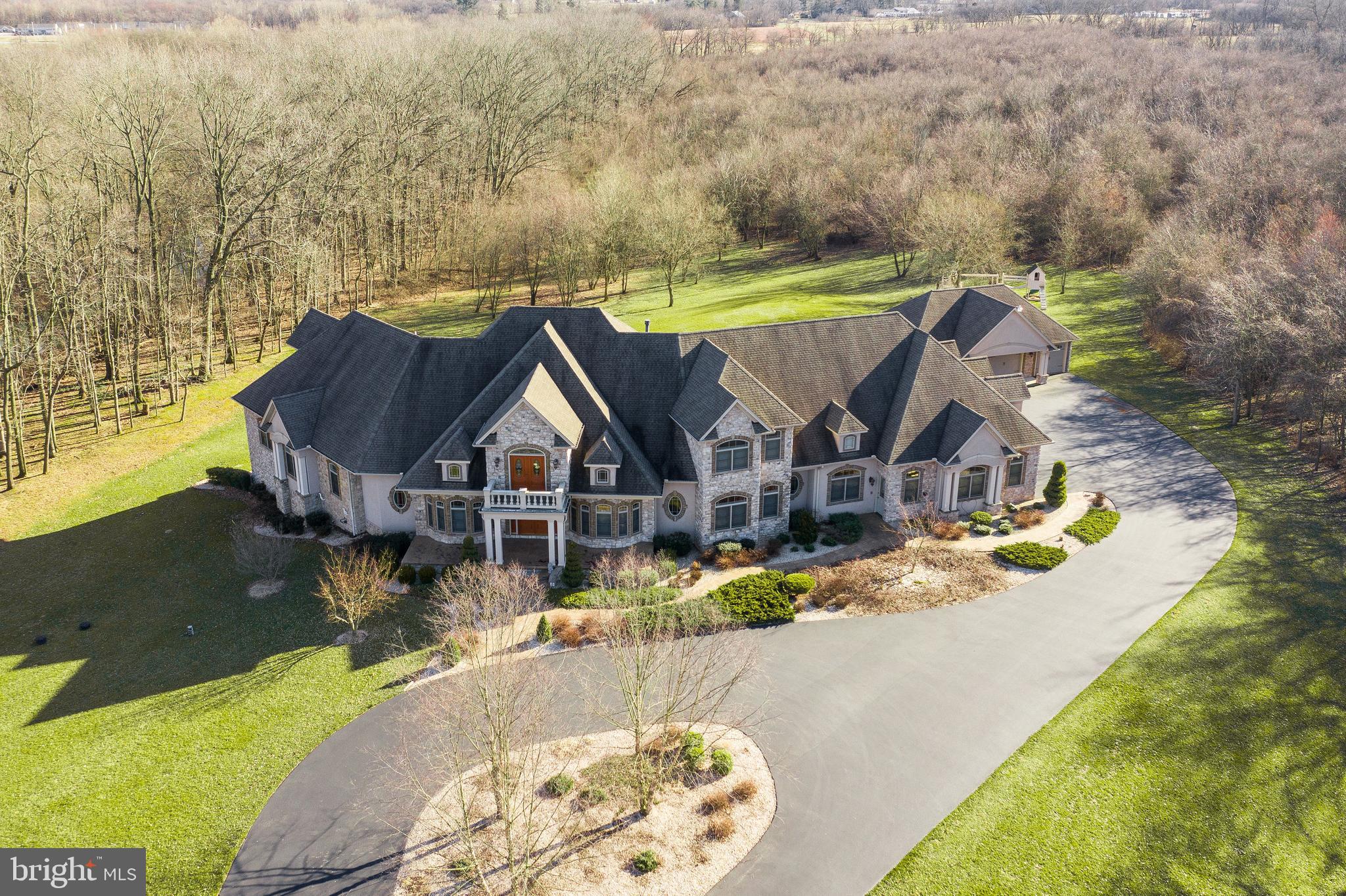 Stunning custom built home with over 10,000 sqft of luxury living! Attention to detail and craftsmanship can be seen throughout this exquisite home. Spacious gourmet kitchen with stainless appliances and commercial refrigerator, that is perfect for any would be chef who enjoys cooking. Large master suite features spacious walk-in closet and attached bath with whirlpool tub and a showstopping shower. Relax with the privacy of your indoor pool and hotub that affords you year enjoyment. All of this is located on 35 acres of your very own scenic country paradise. You must see this home in person to appreciate all that it offers!