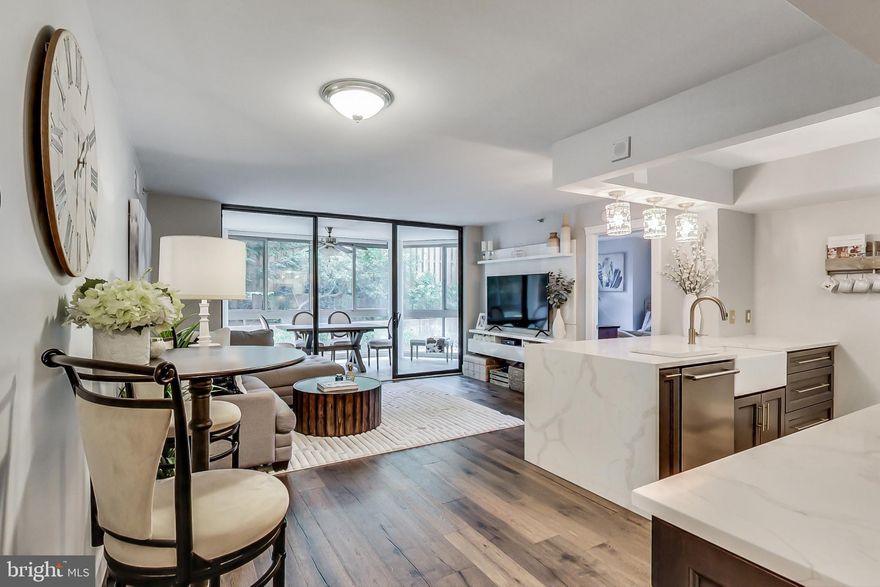 In the heart of Ballston, a must see beautifully updated 2 bd/2ba Dover Model in Westview at Ballston Condominium.  Remodeled kitchen with new soft close cabinets and built in organizers.  Stunning Quartz  Calacatta countertops, marble backsplash, white farm sink and stainless steel appliances complete the kitchen.  Coffee/ dry bar with built in wine cooler provides tons of extra storage and counter space.  Newly installed high end wood flooring, new moldings and built in entertainment wall in the family room give a bright and modern look to this home.   The sun room has new windows and custom remote controlled day/night blinds.  The 2 bedrooms are huge, have walk-in closets with organizers and new windows with plantation shutters.   Ensuite bath in the main bedroom and 2nd full bath just across from 2nd bedroom makes this an awesome floor plan for a roommate, if desired.  Stacked front load washer/dryer in unit.  Reserved garage space, rooftop pool / BBQ area with grills, fully equipped gym, electric car charging station, community and computer rooms are just a few of the great on-site amenities.  Just a block and a half from the Metro and steps to restaurants and shopping, easy access from Rt 66, Wilson Blvd, Glebe Rd, Washington Blvd and Rt 29 make this the perfect location.