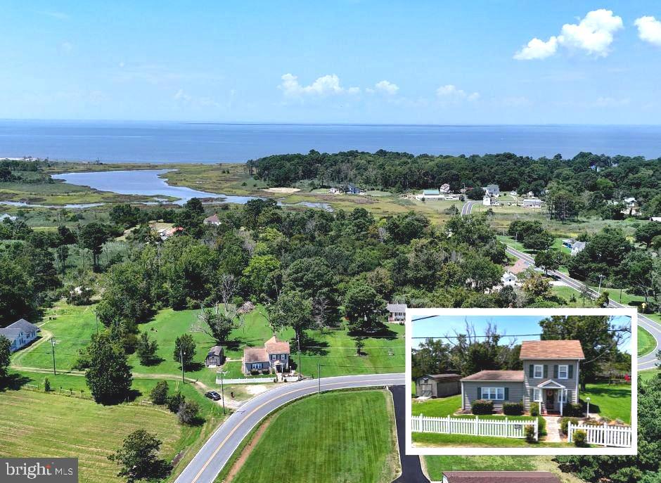 Welcome to your peaceful coastal country retreat on 4.19 acres in the heart of Deal Island. This inviting 2-bedroom, 2-bath farmhouse offers a warm blend of classic charm and comfortable living, featuring an eat-in kitchen, spacious living room, separate dining area, and a bright sunroom that's perfect for unwinding. The dining room could also be used as a entry level bedroom or as a den.
Upstairs, you'll find two well-sized bedrooms along with a loft area that could serve as an ideal reading nook or study space. The main level includes a generous laundry room and a full bathroom with a walk-in shower. Hardwood floors run throughout much of the home, with luxury vinyl plank in the kitchen and carpeting upstairs, creating a seamless mix of style and practicality.
The expansive yard (over an acre of open space) backs to 3 additional wooded acres, offering both privacy and potential. With a separate perc test already on file, there's an exciting opportunity to build a second home, guest cottage, or workshop in the future. Whether you’re interested in hunting, gardening, or simply enjoying the peaceful surroundings, this property provides the flexibility to make it your own.
Ideally located less than a mile from the harbor, you’ll enjoy easy access to public boat ramps, three marinas, public hunting grounds, and a local beach. Whether you're an outdoor enthusiast or seeking a tranquil place to recharge, this home delivers the best of country living by the water.
Passed down through generations, this one-of-a-kind property is full of character and ready to begin its next chapter. Don’t miss this rare opportunity to own a truly special piece of Deal Island.