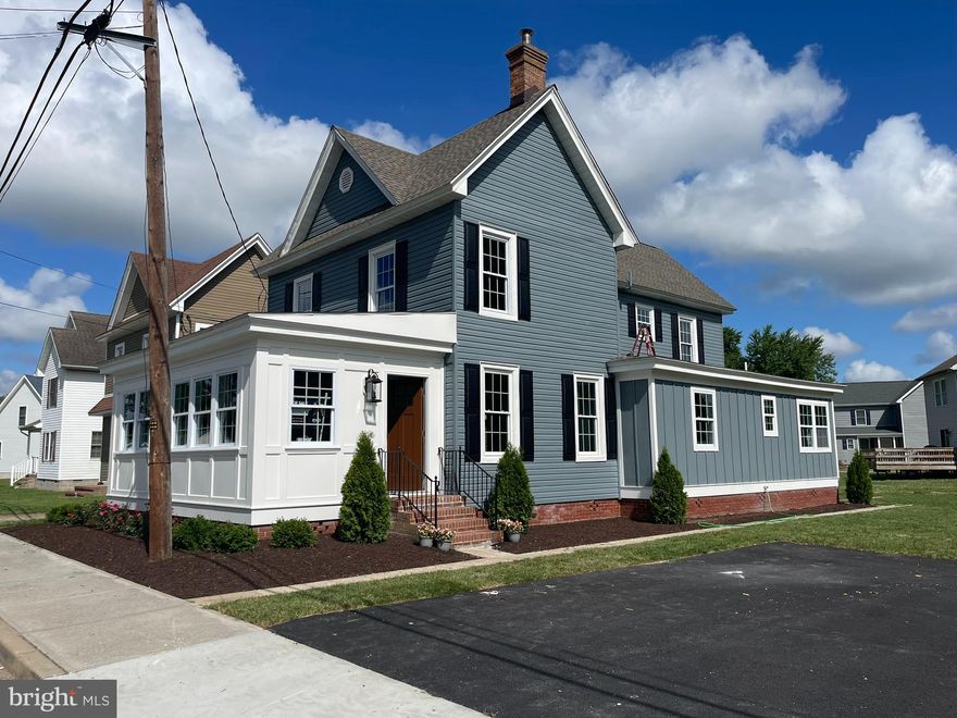 Don't miss this gorgeous, newly restored home with a large newly landscaped yard located in downtown Hurlock Maryland! This luxurious 4 bedroom 3 bath 1920 home is loaded with timeless charm and elegance. Amenities include an all-new kitchen with granite countertops & stainless steel appliances, new bathrooms on the first and second level, a large sunroom with Spanish tiles, and newly refinished antique hardwood floors & trim throughout. You will enjoy entertaining family and friends in the spacious living and dining room. The list of improvements continues with an all-new roof, dual-zone central heating and air, wood-burning wood stove, energy-efficient windows, tankless water heater, electrical service, and much, much more!