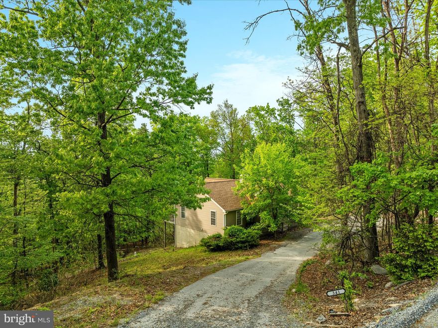 High atop the western slope of the Blue Ridge Mountains, and nestled between the Appalachian Trail and the Shenandoah River is the community of Shannondale. And here, at one of the highest perches of this beautiful spot is 341 Wren Ln. In the wintertime when the trees are bare, the views are, well, “top of the world”. <br><br>
Step inside the open floor plan with vaulted, beamed ceilings and skylights, and an enormous stone woodburning fireplace grounds the space. From there, the floorplan just works. You’ll see. <br><br>
This 2000sf home with 3 bedrooms and 3 full baths has many new touches – the entire main level has new paint and flooring (LVP and carpet) and the kitchen features brand new quartz countertops, sink, faucet and disposal.  There is a deck that spans the entire back of the home, where peace and quiet are found 24/7.<br><br>
The lower level has 800 finished square feet, perfect for a rec room, office, exercise area, or even to have a guest space. The full bath in the lower level makes it practical and functional for all of your ideas.<br><br>
No HOA, no “next door neighbors” except the wildlife. <br><br>
This may be your weekend escape from NOVA/DC, or your forever home. It’s spacious enough and designed to work easily either way. So come check it out and fall in love.