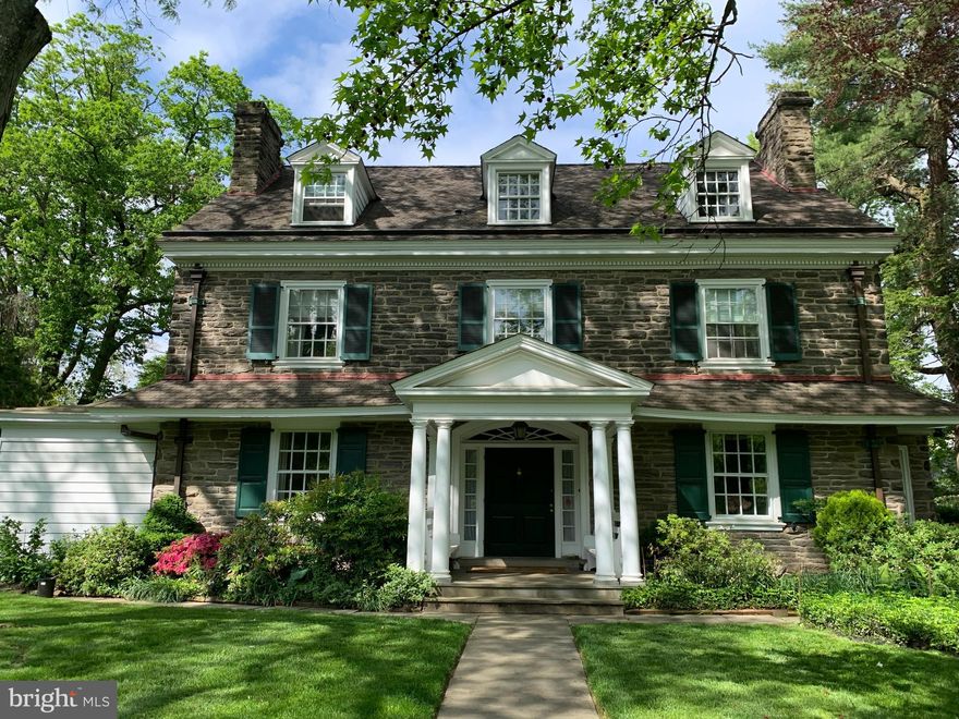 We are proud to offer one of Chestnut Hill's most handsome classic stone colonials.  Set back on the property this lovely home boasts many original features, gracious well landscaped grounds with a private patio and a four car separate stone garage.  One enters through a front door surrounded by a decorative transom to a large open front hall with nine foot ceilings and a matching back door leading to a private terrace with a fenced yard.  The living room and dining room flank the grand front hall each  with fireplaces and window seats.  A den off of the living room has built in bookshelves and a door to the outside as well. The Kitchen is eat in and has double exposures creating great light.  A traditional pantry, powder room and coat closet are adjacent to the kitchen.  The back of the house includes a convenient back entrance, a laundry room and a wonderful large Family Room. On the two upper floors there are two suites, an additional four bedrooms and five full bathrooms as well.  With arched doorways, additional fireplaces, decorative moldings, a lovely stairway landing and hardwood floors throughout, these are period details that are not found in today's construction.  Within walking distance to the shops, galleries, farmer's market and restaurants of Chestnut Hill, as well as the trails of Fairmount Park, local schools and clubs, the local regional rail to Center City, this is an ideal Chestnut Hill location. Showings start on Monday, July 6, 2020.  Please make an appointment.