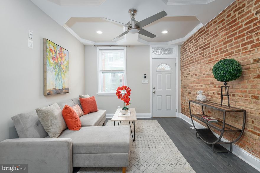 No expense spared in this Patterson Park renovation with much attention to detail.  The main level is open and inviting with hardwoods throughout and tray ceilings, leading you into a custom kitchen with white shaker cabinets, stainless appliances, eat-in island and high-end quartz counters.  Second level offers two large bedrooms with tray ceilings, and a large beautiful bathroom. Lower finished level is set up as an additional family room/den, separate bedroom/office and a full bathroom - excellent set up for having a roommate or hosting a guest. Location is close to Johns Hopkins, Patterson Park, Baltimore Downtown, quick ride to Canton, Fells, and Harbor East.