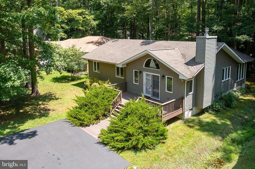 Welcome to 51 Moonraker!  The first thing that you'll notice in this early-1990's 3 BR 2 Ba ranch home is how impeccably maintained it's been!  This home is fully move-in ready, with EVERYTHING remaining - dishes, small appliances, utensils, window treatments, furniture, linens, etc.  This home is ready to enjoy immediately - just close, and bring your beach toys - and you're ready to live and enjoy highly sought Ocean Pines!  The 3 BR home offers ample storage with large closets in all the bedrooms.  Additional storage is available via the pull-down steps in the attic.  The layout itself is open and breezy - perfect for a beach/resort community feel!  If you're headed down in the off-season, enjoy the natural gas fireplace - which throws enough heat to really make the place cozy.  Ocean Pines offers 3 community pools for use, and is a quick jaunt to the OC beaches.  Use the beach and boardwalk, and retreat to the serenity that Ocean Pines is known for!