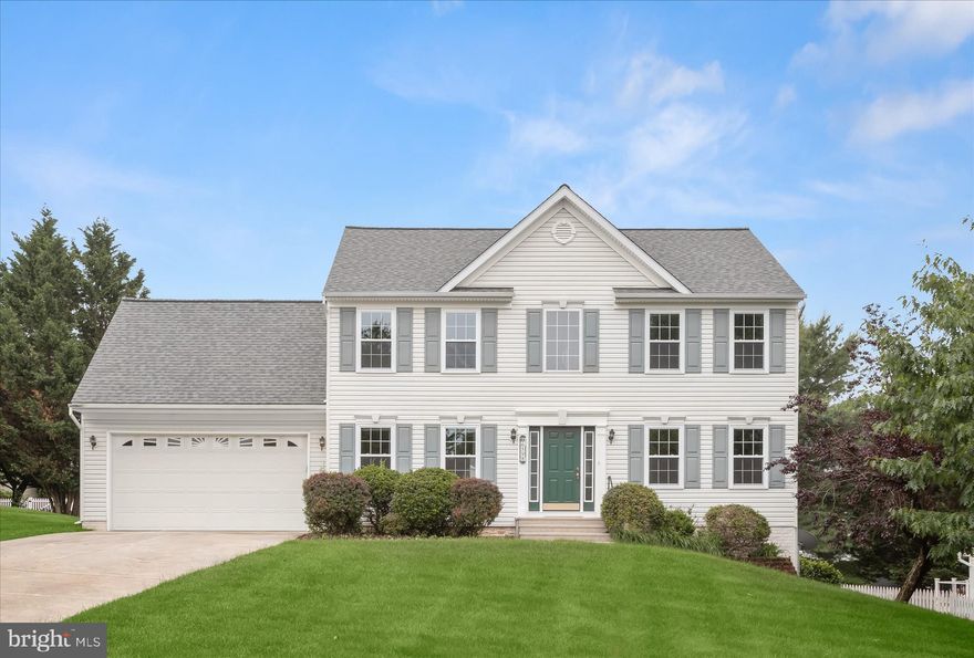 Set on a generous lot in the heart of Eldersburg, this colonial home blends timeless design with extensive recent updates throughout.
Step inside to a dramatic two-story foyer filled with natural light that is complemented by a new chandelier installed in 2026. Formal living and dining rooms flank the entry, with crown molding adding character to the living room and a new dining room light fixture bringing a fresh touch to the space. Further inside, the layout opens into the eat-in kitchen and adjacent family room, creating an airy, connected feel. Hardwood flooring extends through the living room and family room, while the kitchen has been refreshed with quartz countertops, stylish cabinet hardware, stainless steel appliances, and updated flooring. The kitchen also features a pantry, and a sliding glass door leading to the deck and backyard.
A laundry room with garage access and a powder room with updated finishes complete the main level.
Upstairs, the spacious primary suite features an expansive walk-in closet with built-ins and a beautifully updated en suite bath completed in 2026, showcasing a luxury shower with large-format tile and a frameless glass door. Three additional bedrooms share a renovated full bath. New carpet and additional interior painting completed in 2026 continue the home’s refreshed feel.
The unfinished lower level offers exceptional flexibility with walkout access to the backyard, providing ample room for storage, exercise equipment, hobbies, or future finished living space. A two-car garage adds everyday convenience.
Additional major updates include a roof replacement in 2023, windows replaced in 2025, quartz kitchen countertops and kitchen flooring installed in 2025, HVAC system updates with a new AC unit in 2024, hot water heater replacement in 2025, deck painting completed in December 2025, driveway repairs in 2026, new carpet installed in 2026, and extensive interior painting and lighting updates completed throughout 2025 and 2026, including new fixtures in the dining room, foyer, and second-floor hallway.
The home is moments from shopping, dining, grocery stores, fitness centers, Freedom Park, Piney Run Park, Liberty Reservoir, and commuter routes for easy access to Baltimore, Columbia, and surrounding areas.