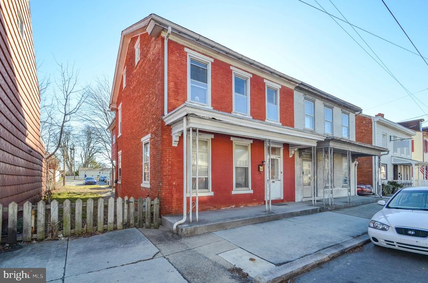 Discover the charm and potential in this 3-bedroom, 1.5- bath twin in Lebanon, PA! The true gem lies in the expansive paved 9-car parking area in the rear – a rare find that combines convenience and practicality for today's lifestyle. Once inside, this spacious brick home boasts a foyer entrance, setting the tone for what lies beyond. Step into a cozy den, a perfect retreat for relaxation, followed by a generous living room. The heart of the home awaits with a spacious eat-in kitchen, featuring convenient laundry hookups and seamless access to the backyard. A second staircase adds a touch of uniqueness and practicality to the layout. The first floor is completed with a modernized half bath, ensuring convenience for both residents and guests. Venture upstairs to discover the second floors' three bedrooms. One bedroom includes an attached sitting room and access to the back staircase, providing a private sanctuary. The full bath and ample closet space add functionality to the upper level. Storage is no concern with a full walk-up attic and basement, offering abundant space for all your belongings. Step outside to a large back yard, providing space for outdoor activities. The covered patio is perfect for enjoying fresh air year-round. While the home requires some TLC and is being sold as-is, the potential for transformation and customization is limitless.