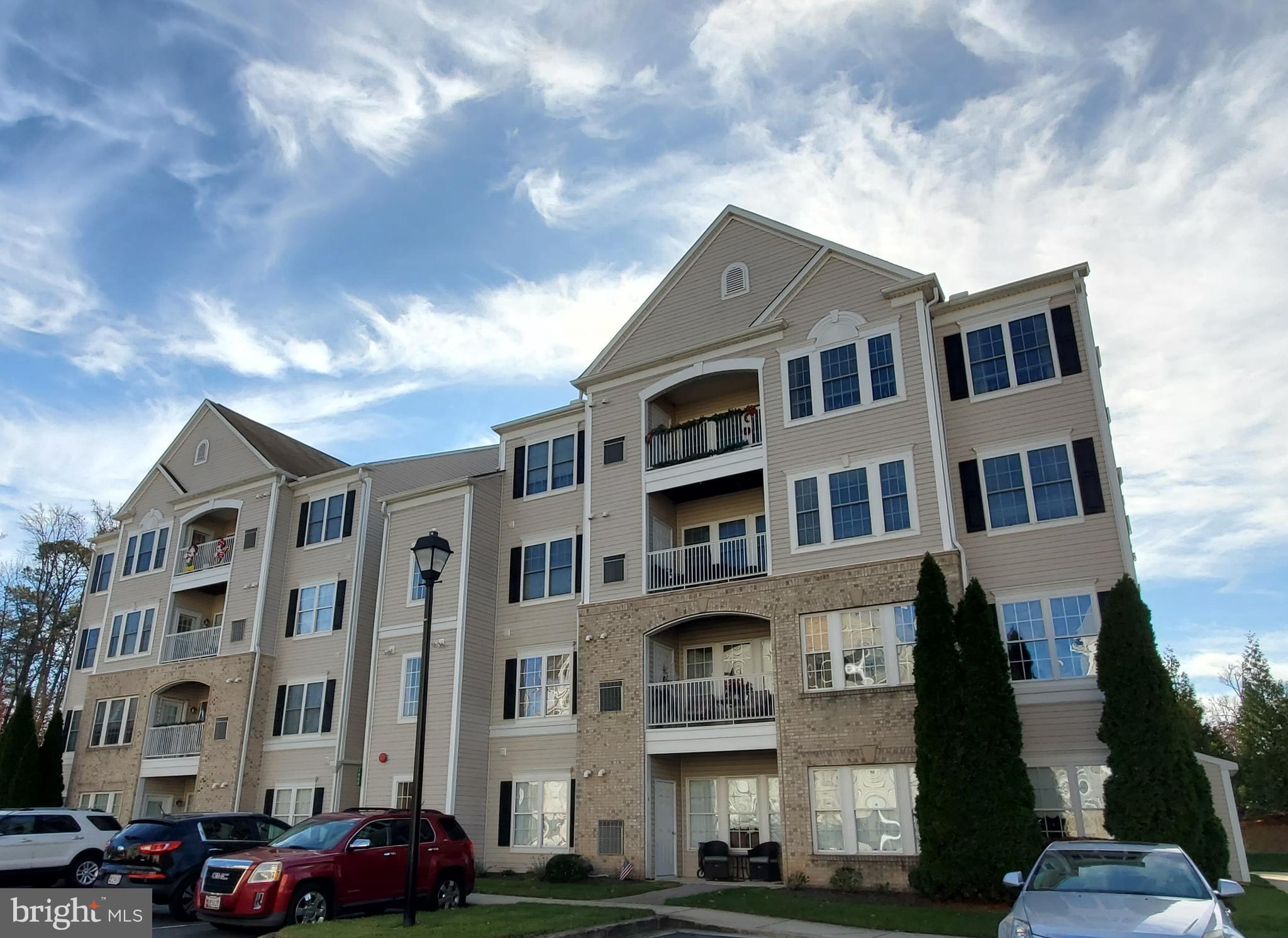 55+ community with elevators in each building. Sunny, bright, TOP floor condo. Approximately 1650 sq feet with 2 bedrooms with 2 full baths. Gourmet kitchen with granite counters, dual wall ovens, built in cutting board (never used - still wrapped in plastic!), gas appliances, double closet for the pantry, low maintenance flooring, ample room for a table and chairs. Living Room opens to the dining room that has crown molding and chair rail. Primary bedroom has an attached seating area that could be used as a den and an en suite bath with double vanity, ceramic tile, and shower with a seat. Second full bathroom opens to the second bedroom and the living room and has a walk-in tub with light and aroma therapy. There is plenty of storage - the primary bedroom has a walk-in closet, double closet in the second bedroom, double closet in the entry, and a storage room off the entry as well. The unit was designed for easy wheelchair access with lower mirrors and light switches. Within a 45 minute drive of the PA and DE state lines, Randallstown, Ft Meade, Millersville and everywhere in between!