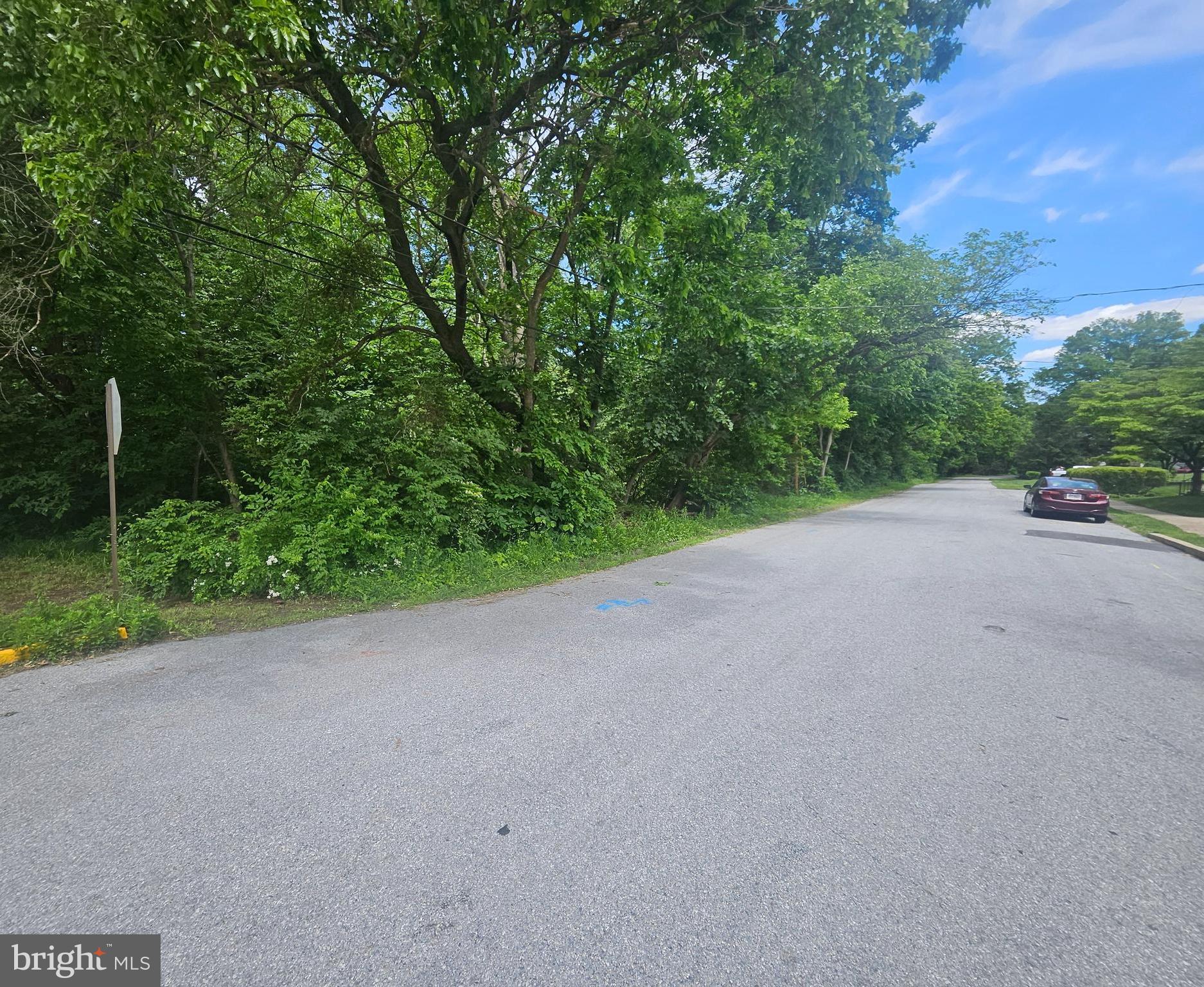 this lot was the town dump. Please do your due diligence. This wooded lot features frontage on Cedar and Arch streets with existing roads in place.